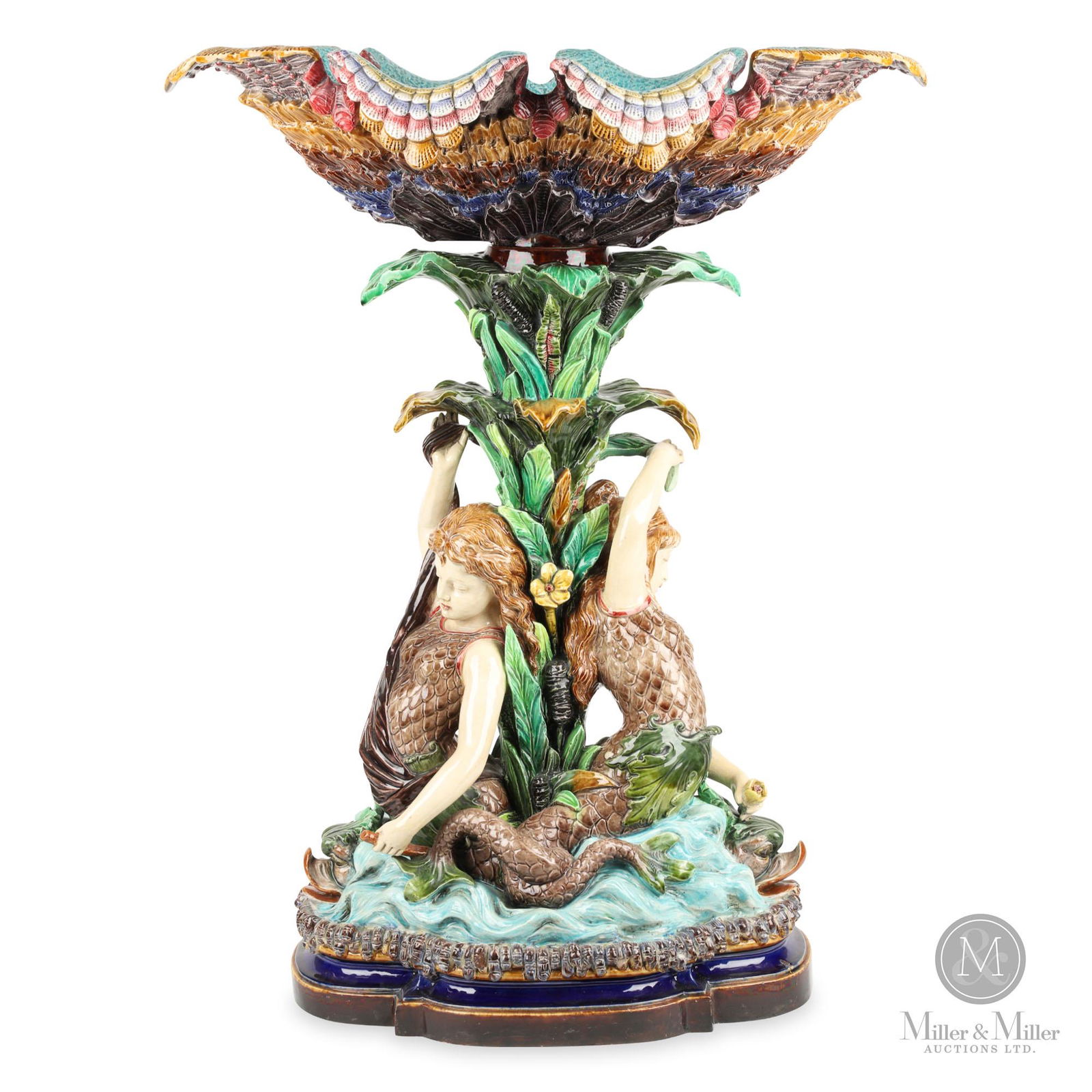 Monumental Majolica Mermaid & Shell Figural Compote: Large shell form bowl supported by mermaid figural supports and large base. Bolted construction. Purportedly exhibited at Meadow Brook Hall, a Dodge family mansion in Michigan. From the Robert Bolus E