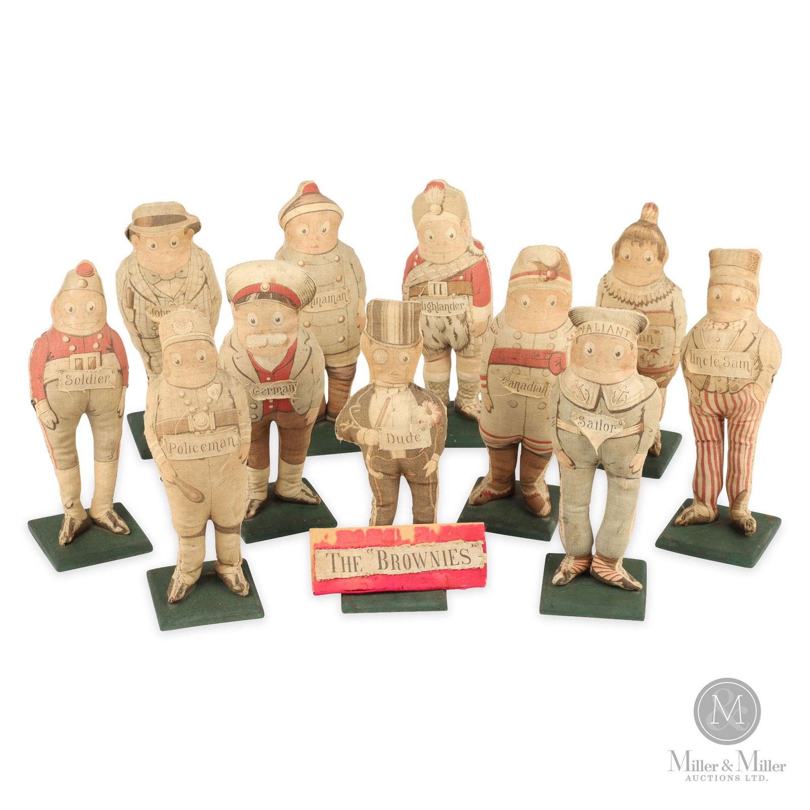 Arnold Print Works Stuffed "Palmer Cox" Brownies: Lot consists of a collection of eleven (11) stuffed "Brownies" and a sign created by Canadian author/illustrator Palmer Cox and manufactured by Arnold Print Works in 1892. The figures include "John Bu