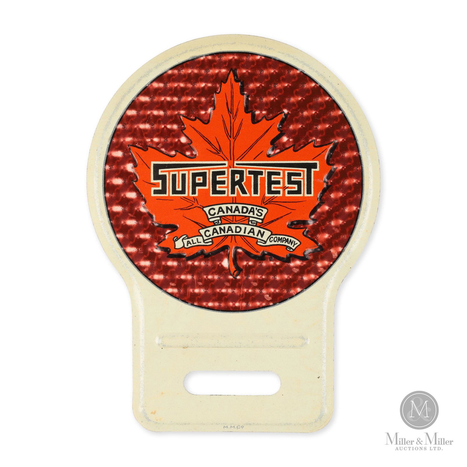 Supertest License Plate Topper: Canadian. 1940s. Lithographed tin. Found in unused condition with original wax paper. Features reflective embossed red ground. Marked, "M.M. Co" lower edge. (Macdonald Manufacturing Company, Toronto).
