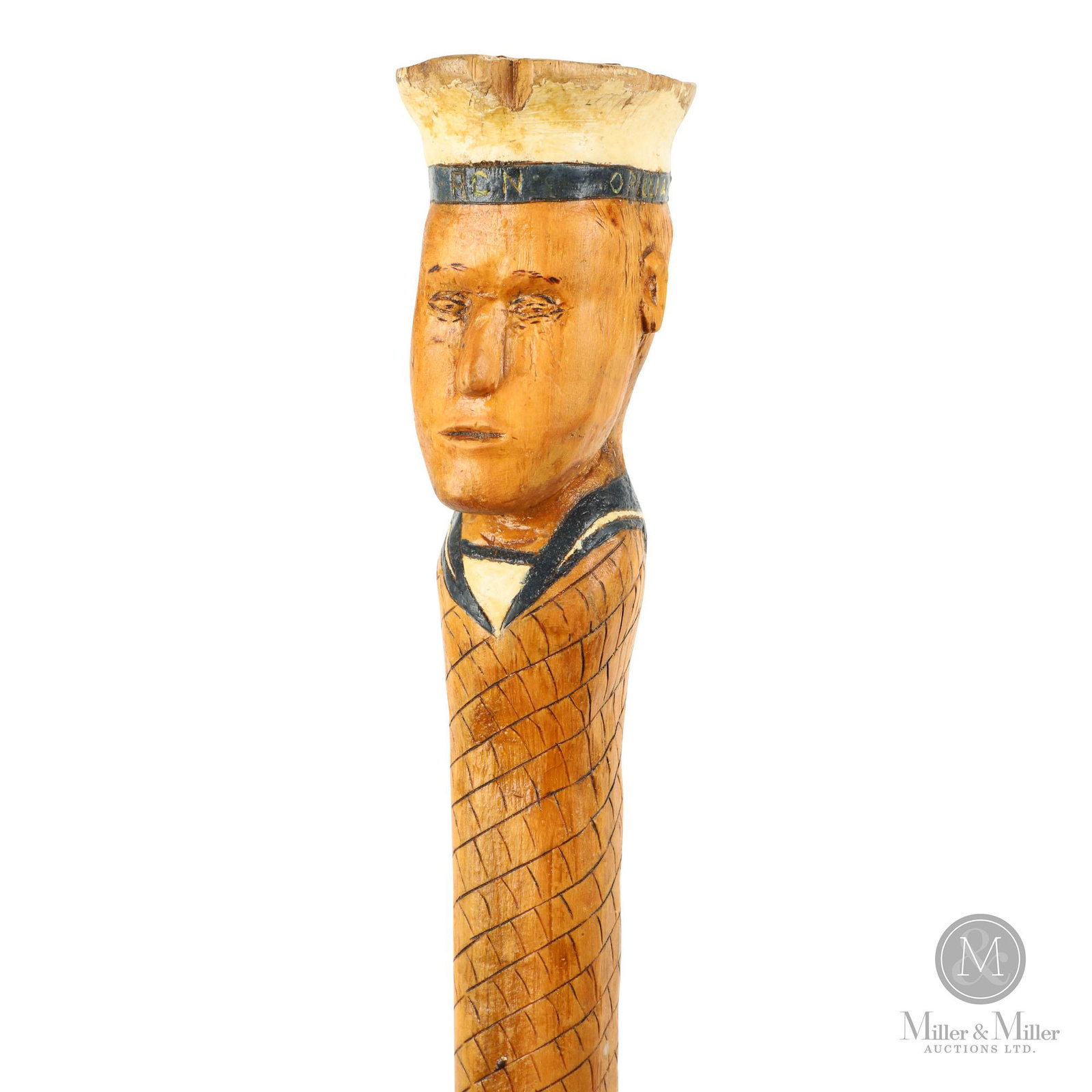 Royal Canadian Navy HMCS Orillia Sailor Walking Stick: Canadian. First half 20th C. Pine-carved with a portrait bust of a Royal Canadian Navy sailor wearing a cap with inscription "Orillia RCN Orillia". The shaft is carved in a repeating tiled pattern and