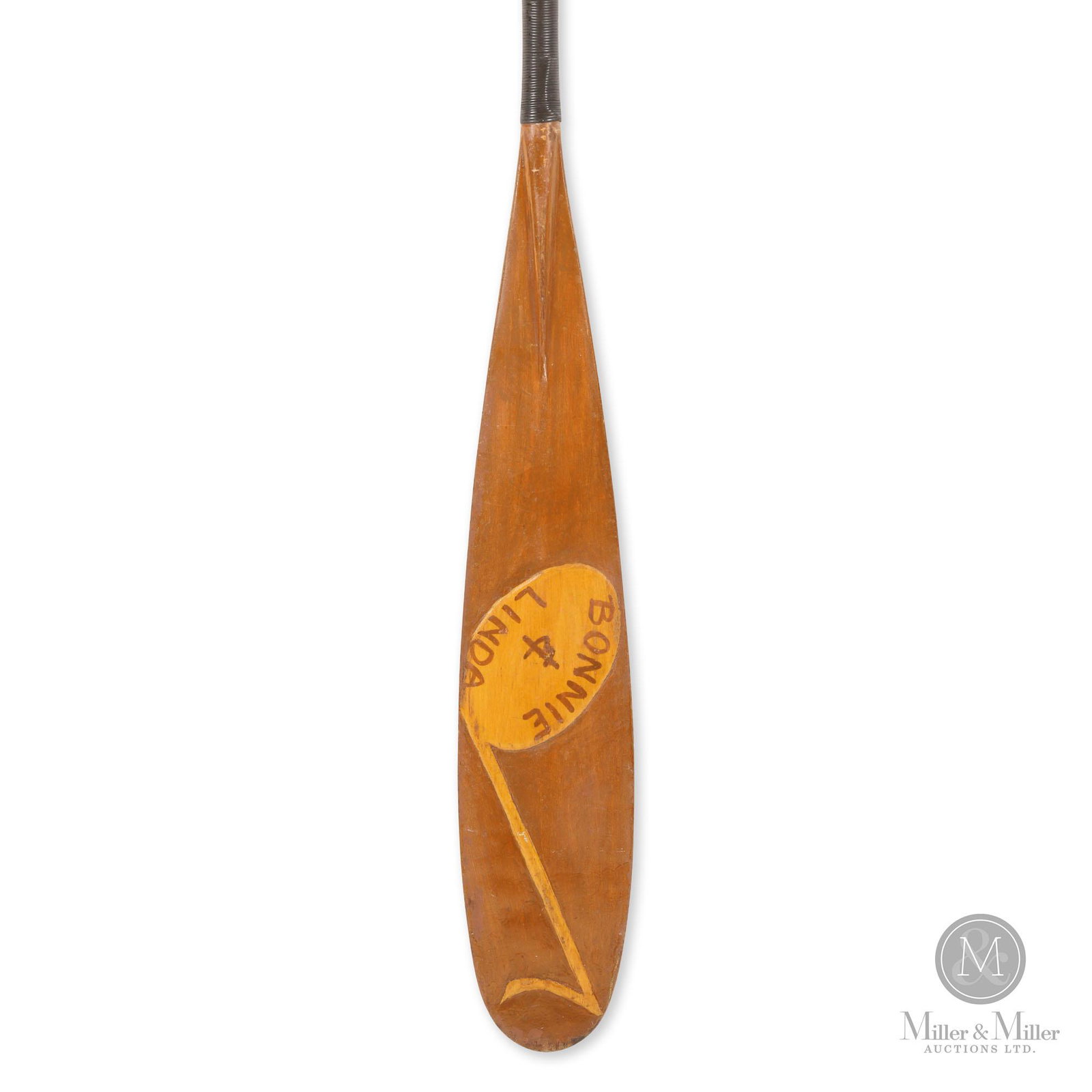 Bonnie & Linda Decorated Canoe Paddle: Ontario. Mid-20th C. Maple. Painted. Raised carving of a musical note to blade and with painted inscription "Bonni & Linda". Wrapped hand grip. Good condition with signs of use and age. 60(L) x 5.25(W