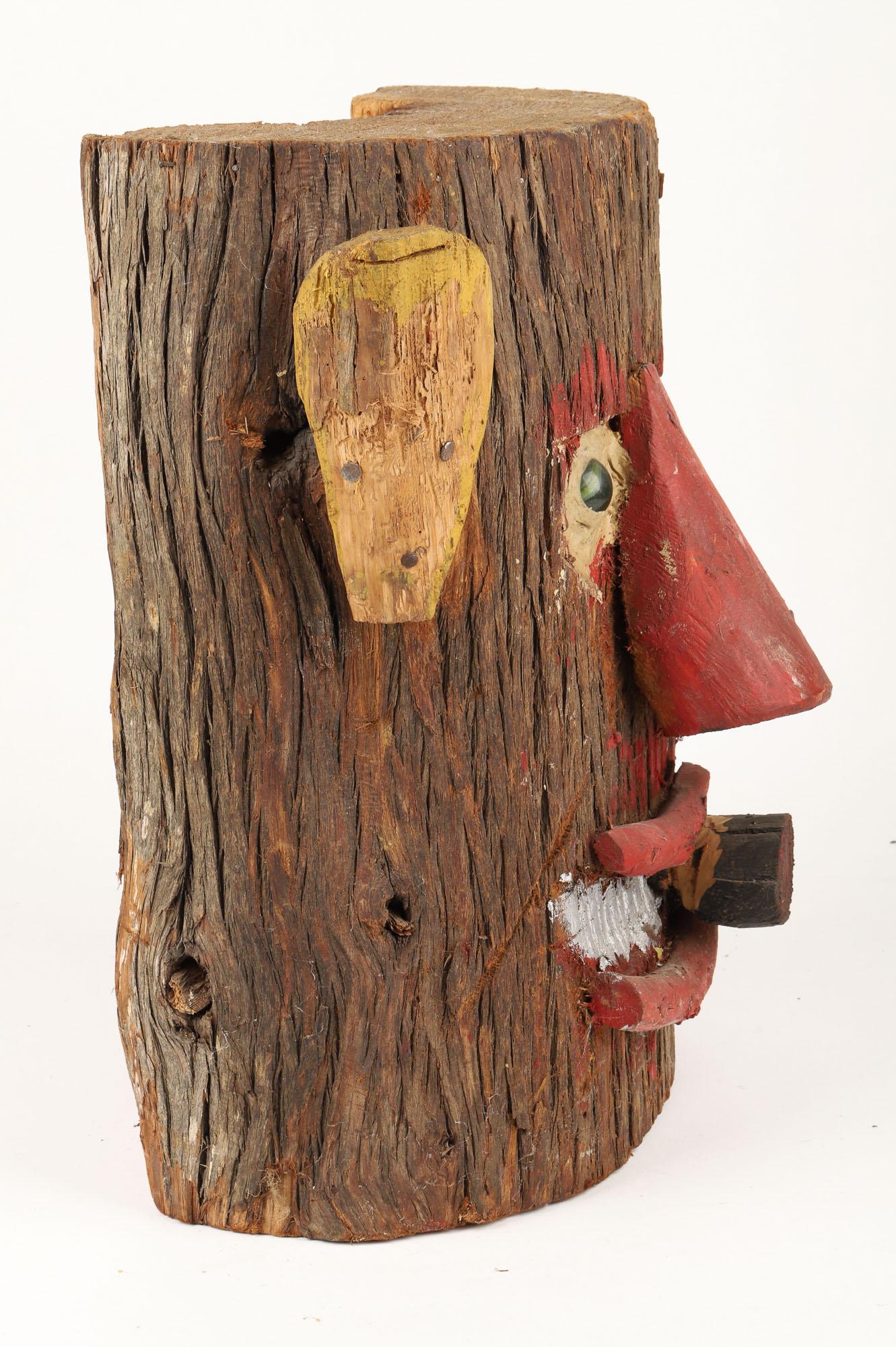Cigar-Smoking Log Head by George Cockayne