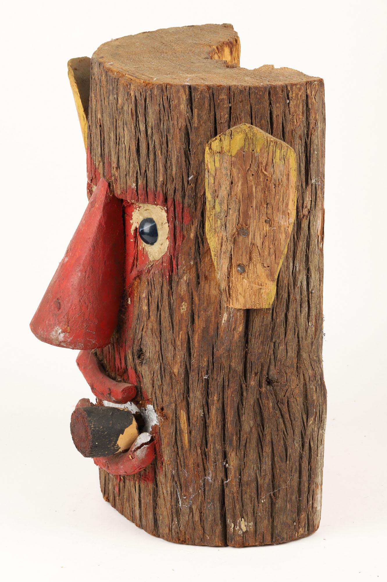 Cigar-Smoking Log Head by George Cockayne