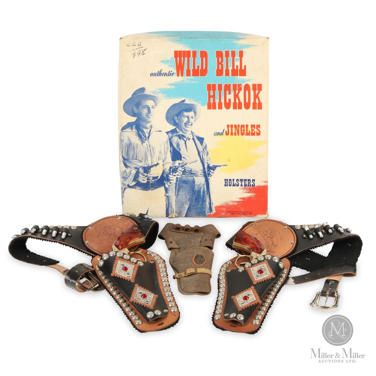 Wild Bill Hickok and Jingles Holster Outfit: Canadian. 1950s. Flashed cast metal cap guns with studded and jeweled stamped leather holsters. Marked, "Manufactured in Canada by M.A. Henry Limited, Dundas, Ont." on the box. In original graphic box