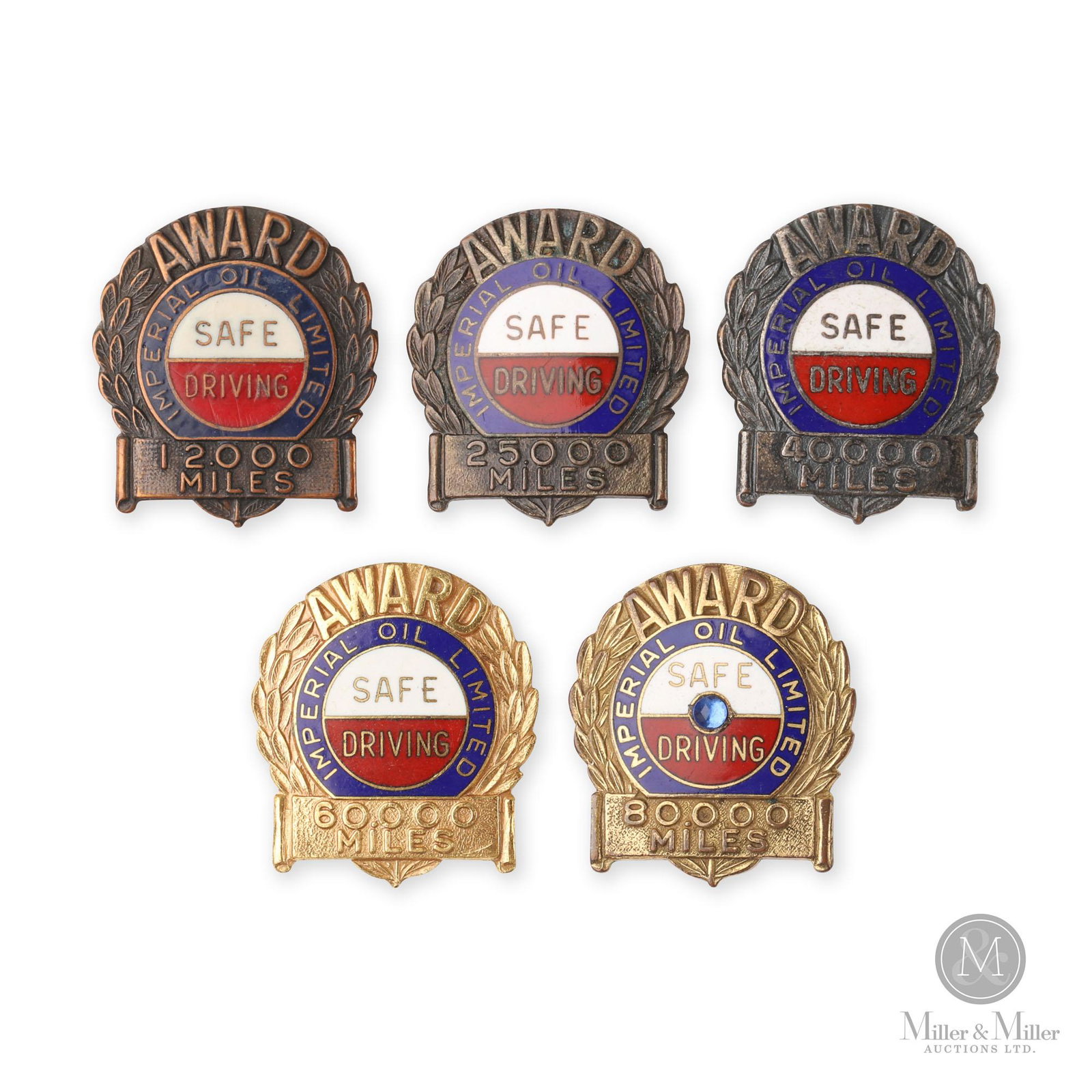 Imperial Oil Safe Driving Award Pins: Five (5). Canadian. 1940s. Copper, bronze and gold plated. The pins span from 12,000 miles to 80,000 miles. Each with screw back present. Uniform toning. 40,000 mile example is stamped on back, "Troph