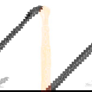 Highly Decorated Iroquois Carved Cane: North American. Hardwood. An Iroquois carved hardwood cane with the Chief's headrests and a native holding a tomahawk pipe, a dove of peace, and an anchor. The shaft culminates in two hands clasping a