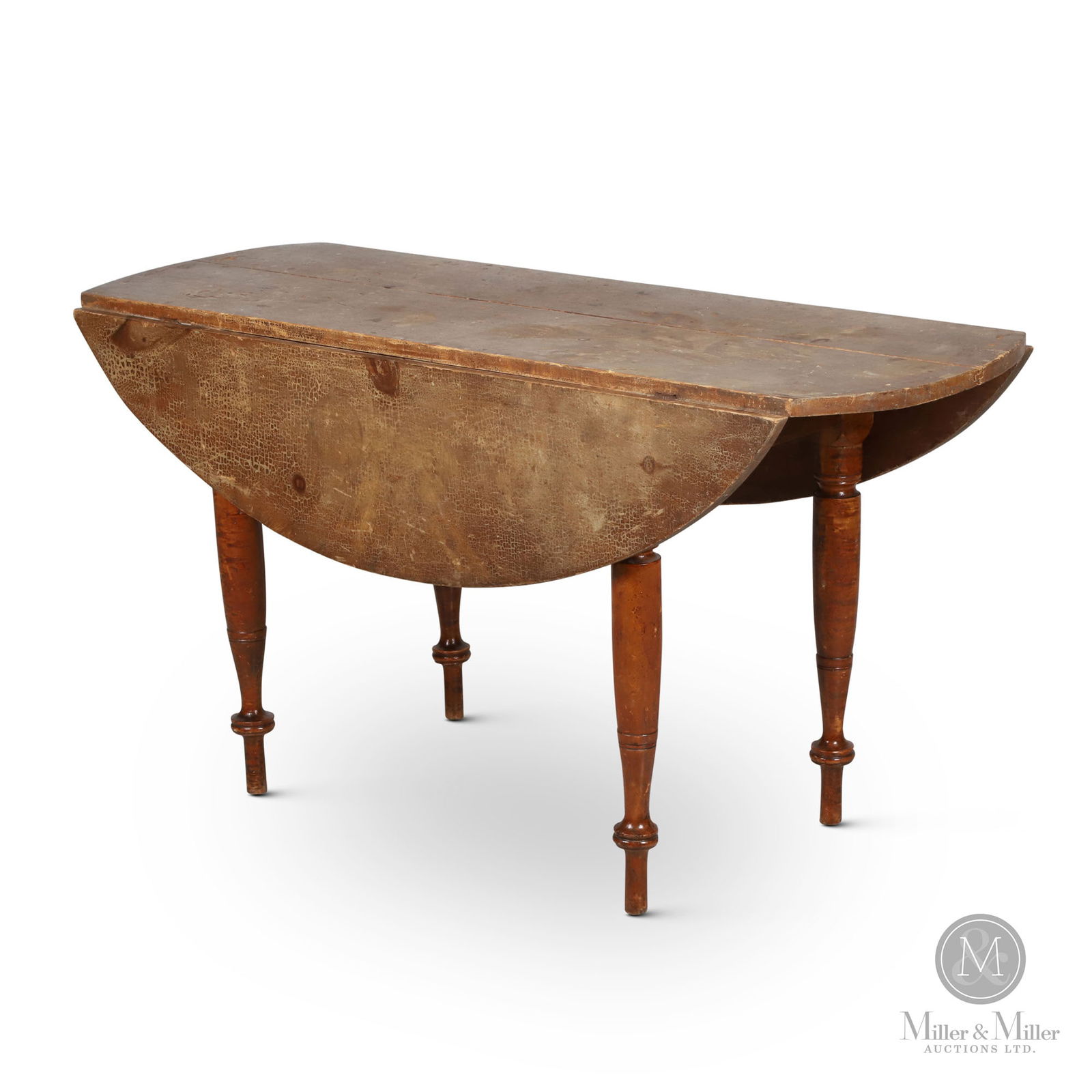 P.E.I. Drop-Leaf Oval Figured Kitchen Table: Prince Edward Island. In hardwoods, with pine top. Oval drop-leaf table from Prince Edward Island. The pine top has a good overhang at each end with the narrow leaves being supported on lopers. The ba