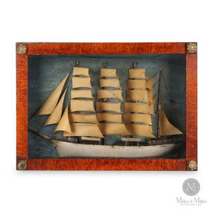 1870s American Ship Diorama: American. Wood, gesso, paper, string, wire. American diorama of a four-masted sailing ship flying the American flag. The faux tiger maple-painted box has gilt rosettes in each corner. The unnamed ship