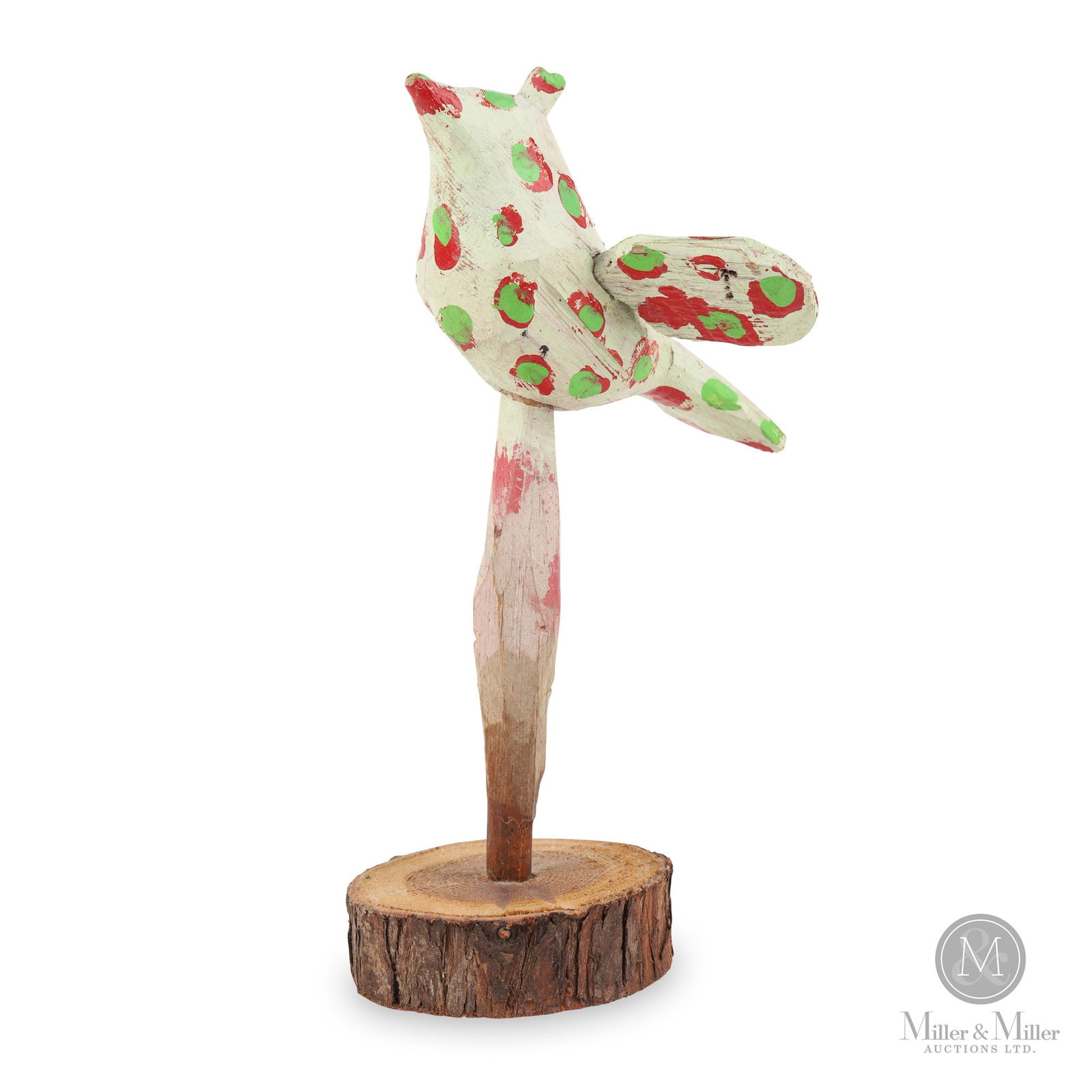 Spotted Bird Carving by Edmond Chatigny: Quebec. C. 1975. Softwood, paint Edmond Chatigny created this little bird as a component in his yard art. Its delicate nature, painted in red, white and green, makes it charming. The figure perches on