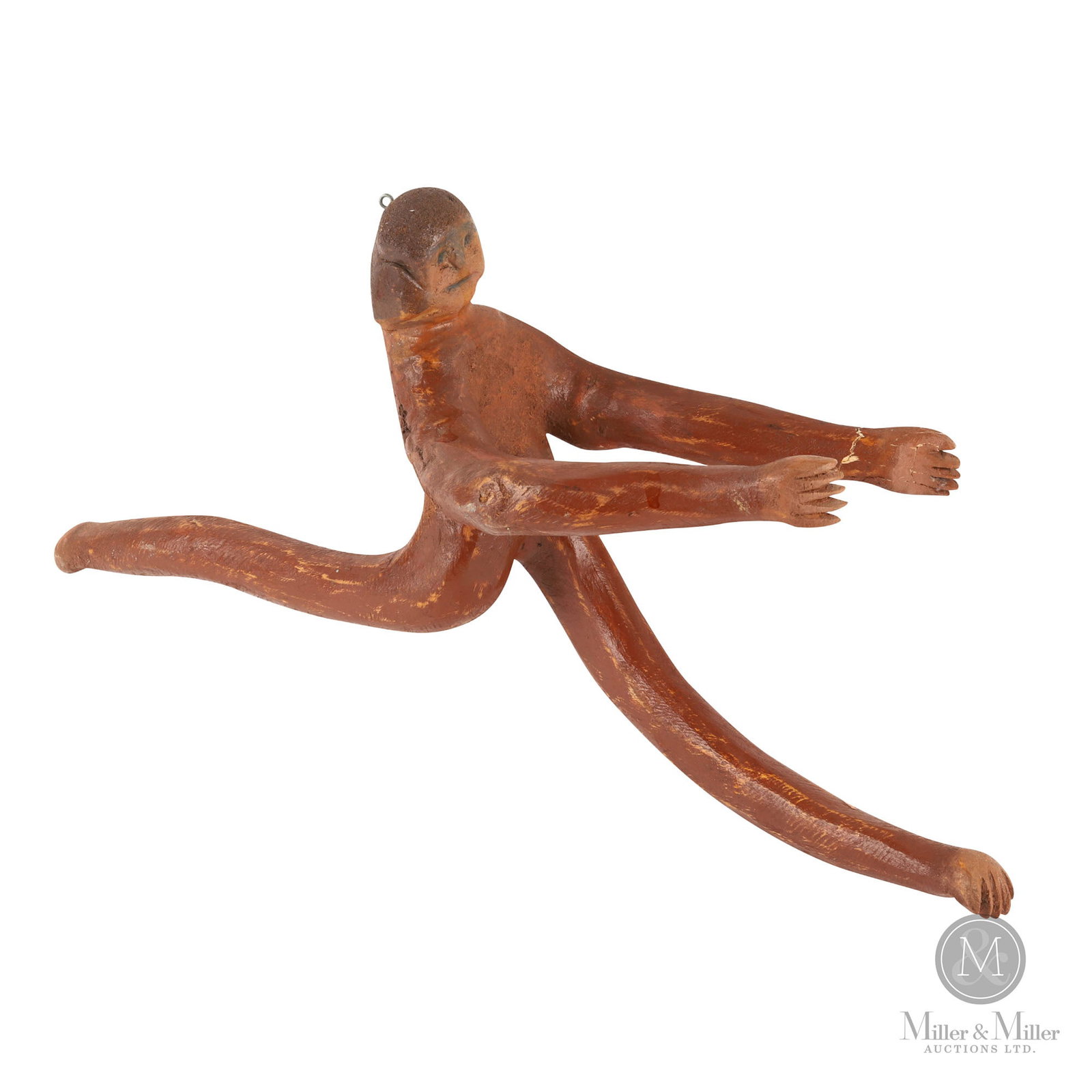 Carved Mobile of Reaching Man: Beardmore, Ontario. C. 1980. Softwood. A folk art carving of a man is painted in brown with grey-black details to the face. A hook and wire are attached for hanging, possibly intended as a mobile or p