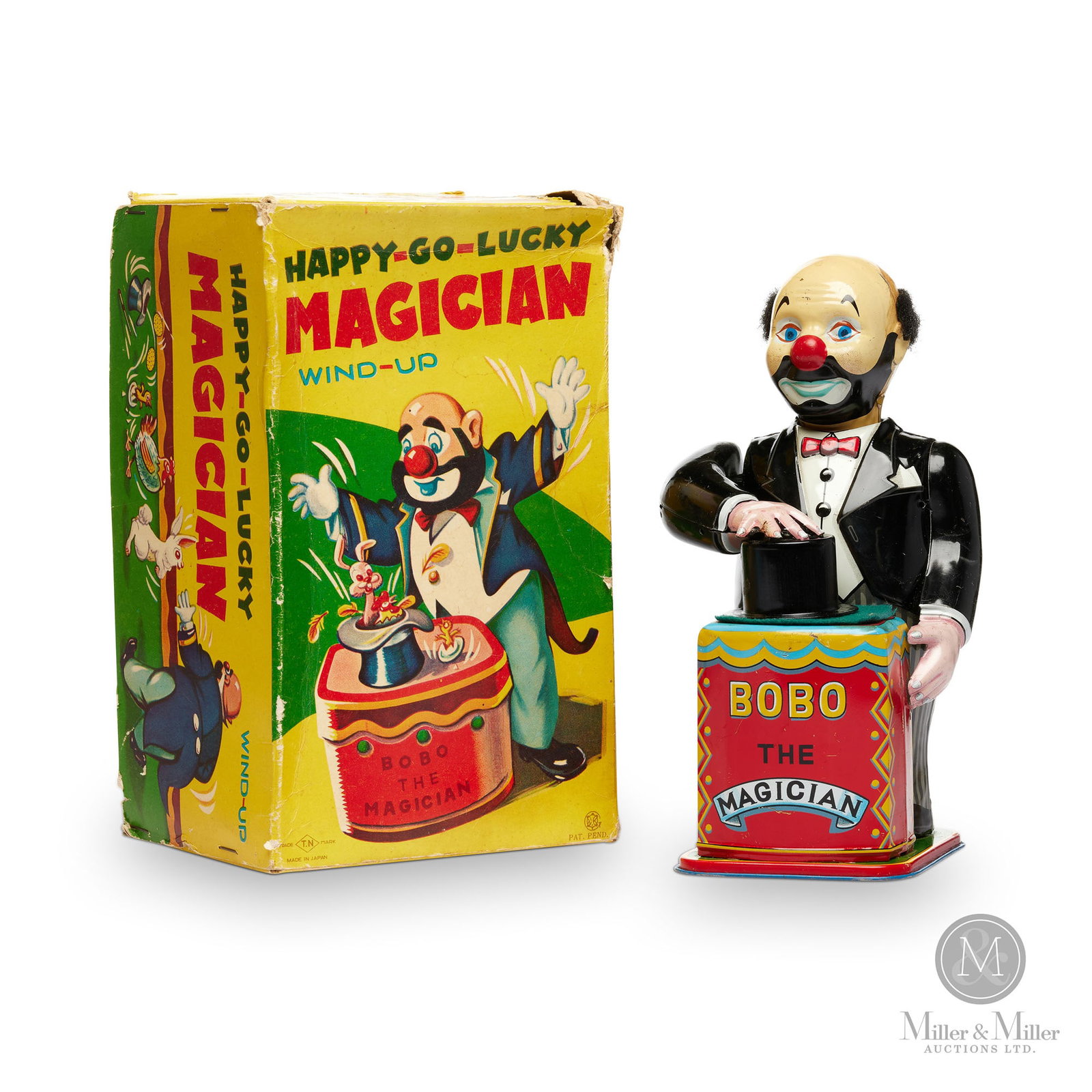 Nomura T.N., Japan Happy-Go-Lucky Magician: Japanese. 1950s. Lithographed tin. Marked on box lid (lower right corner) and on back of toy's ankles. Toy: 8.25" x 4.5" x 3.25". Box: 4.5" x 9" x 5.5". The Howie Meyer Legacy Collection.