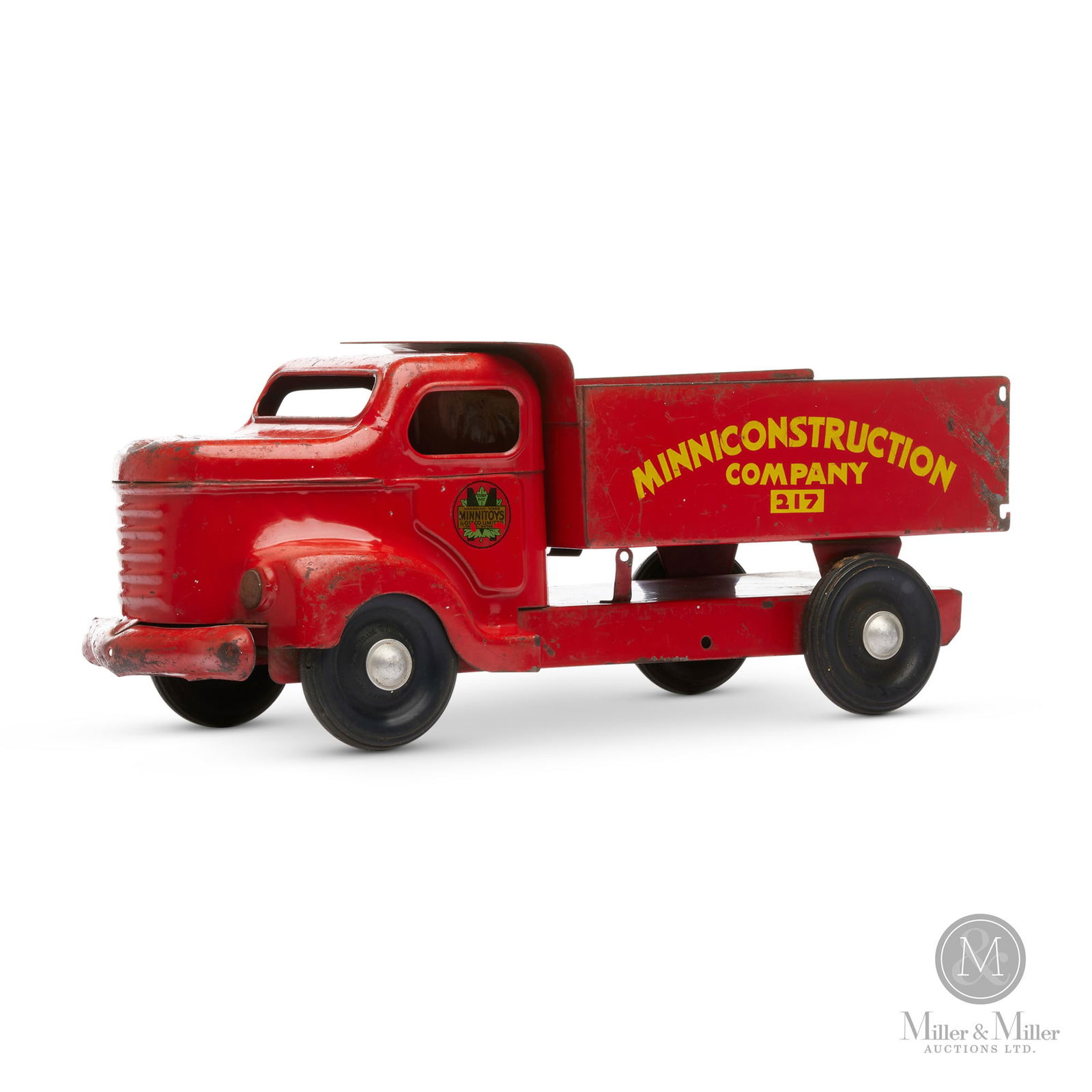 Otaco, Minnitoy Minniconstruction Company #217 Dump Truck: Canadian. 1940s. Pressed steel. Manufactured in Orillia, Ontario by Otaco (Orillia Tudhope Anderson Company). Minnitoys were created primarily for the post-war 'baby boom' market. Marked on doors of c