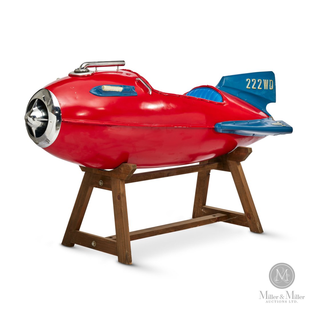 Amusement Park No. 222WD Rocket Ship Ride: American. Circa 1950. Steel. Wood stand. Comes with a custom-crafted stand. Marked "222WD" and "E" on tail and wing. 24" x 75" x 25". The Howie Meyer Legacy Collection.