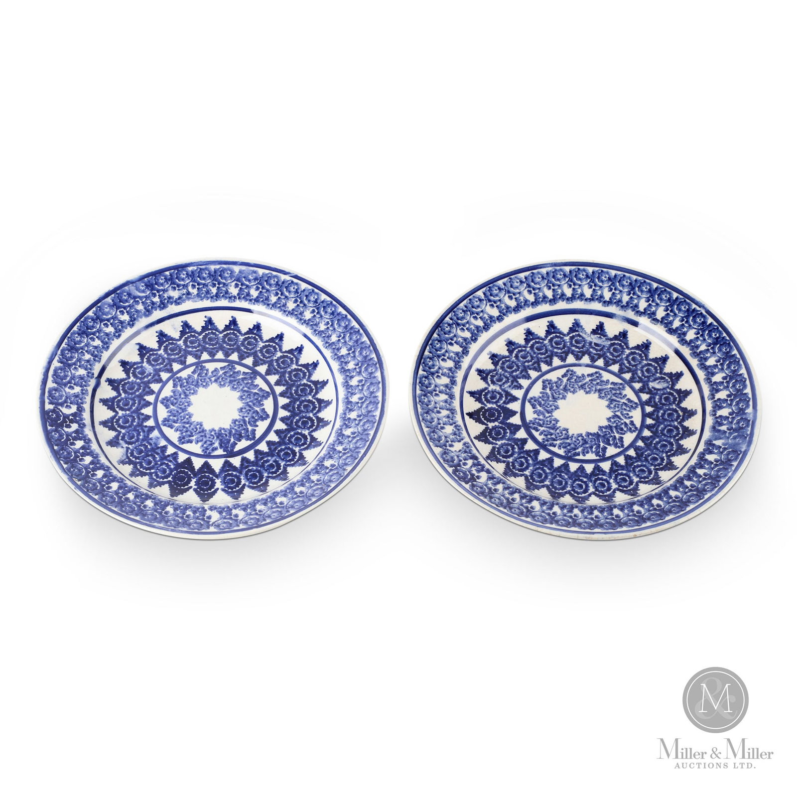Pair of blue Portneuf plates: A pair of blue Portneuf plates with rosettes around the rim and profusely decorated with sponged motifs. Very good condition, Scottish circa 1875. Each 9.5" dia. From the Kathryn and late David Richar