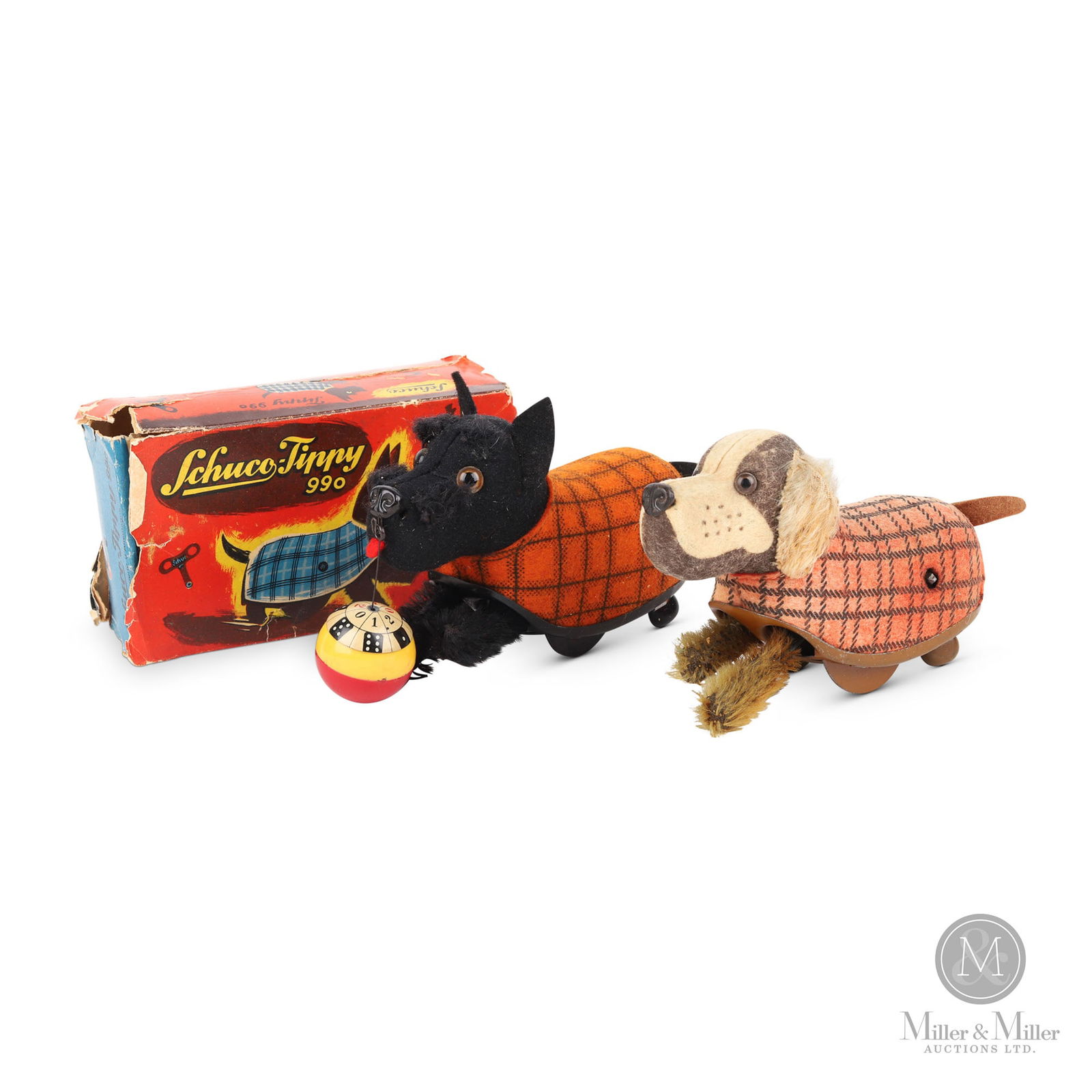 Schuco 990 Tippy Scottie & Spaniel Dogs: German. 1940s. Tinplate, fabric. Black Scottie dog (990) is marked "U.S.-Zone Germany". Post-war German manufacturers were banned from exporting goods. Americans occupying the territories permitted th