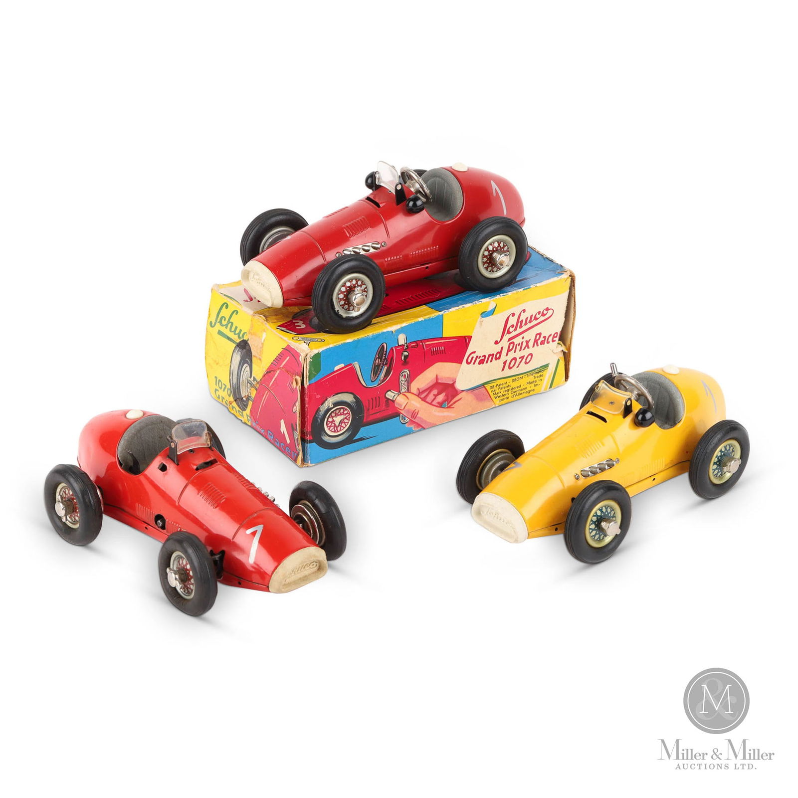 Schuco 1070 Grand Prix Racers: German 1950s. Tin rubber, plastic. The toy cars are marked "U.S.-Zone Germany". Post-war German manufacturers were banned from exporting goods. Americans occupying the territories permitted the sale a