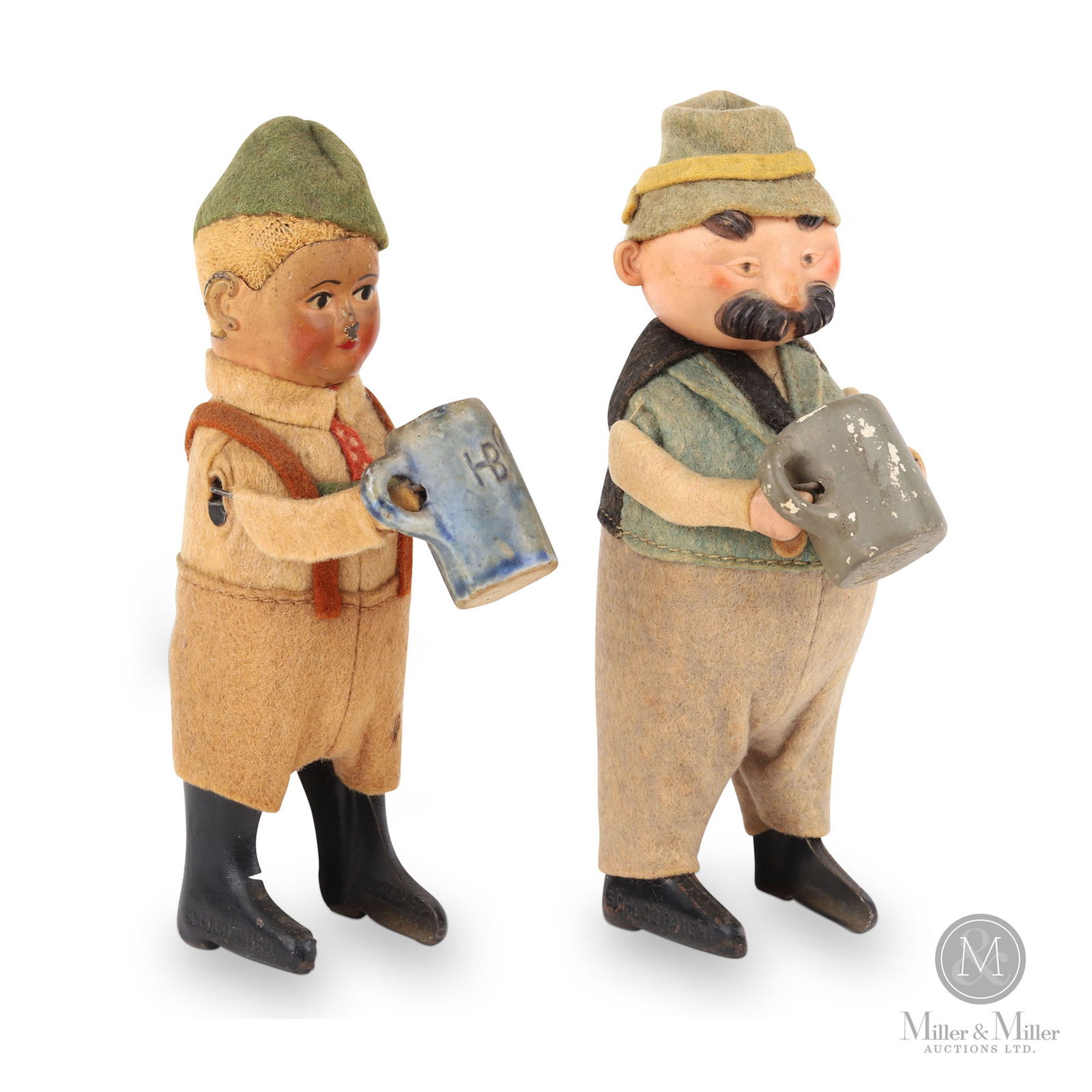 Schuco 972 & 982 Drinking Tyrolians: German. 1930s. Metal, fabric. 982 is the man with the green felt hat and 972 is the man with the moustache. Marked, on sides of feet of both. Each 5" tall. The Howie Meyer Legacy Collection.