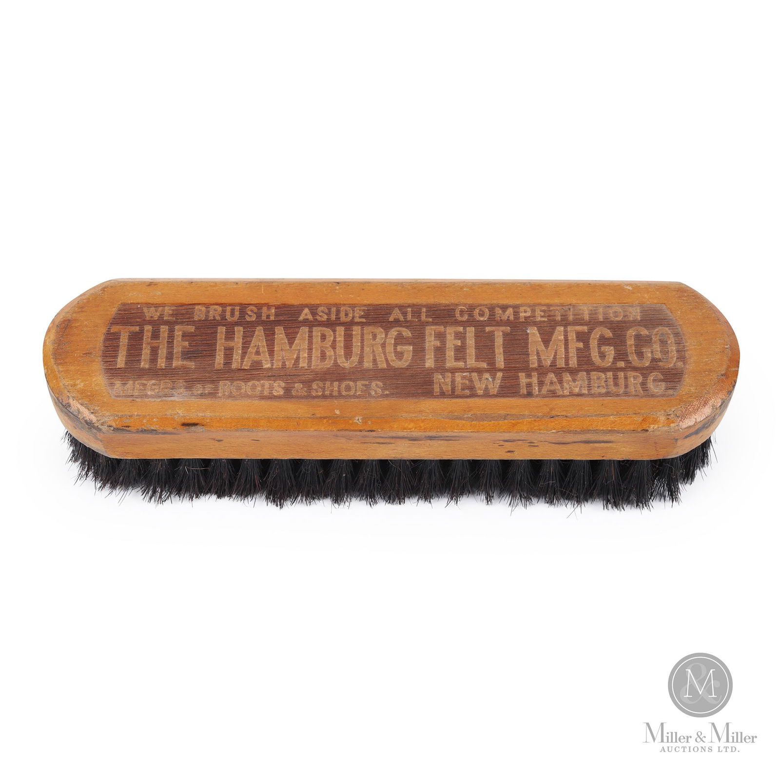 Hamburg Felt Mfg Co. New Hamburg, Ont Boot Brush: Canadian. 1900s. Stamped wood. Stamped, "Made in Germany", on one side of handle. 2.5" x 8.5" x 1.75". From the William Robert Wilson Collection.