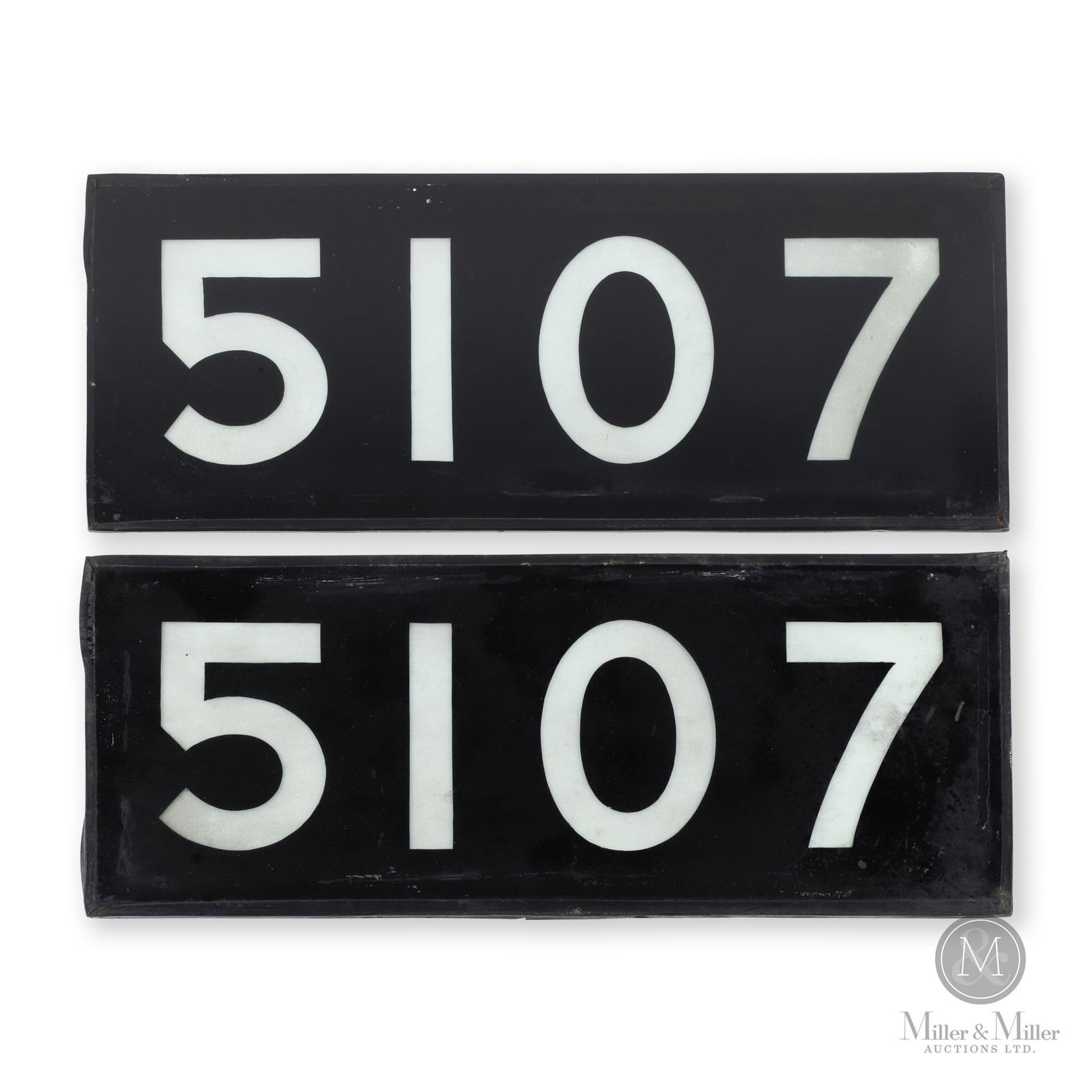 Reproduction CNR 5107 Locomotive Number Panels: Canadian. 1960s. Glass. These were used on the train for a short period of time in the 1960s. 8" x 19.5" x 0.25". From the William Robert Wilson Collection.