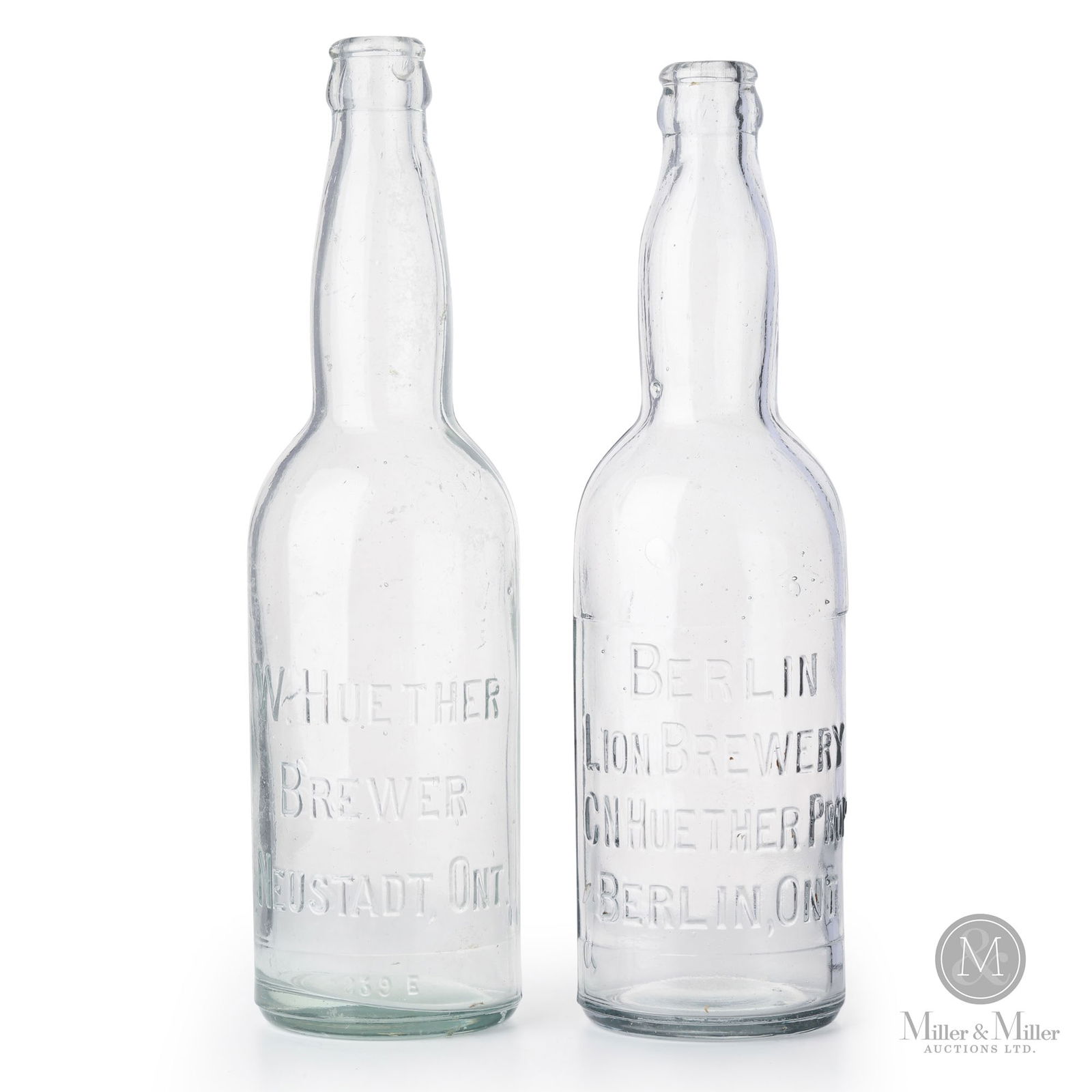 Huether, Neustadt & Berlin, Ontario Beer Bottles: Canadian. 1910s. Glass. 10" x 2.75" x 2.75" each. From the William Robert Wilson Collection.