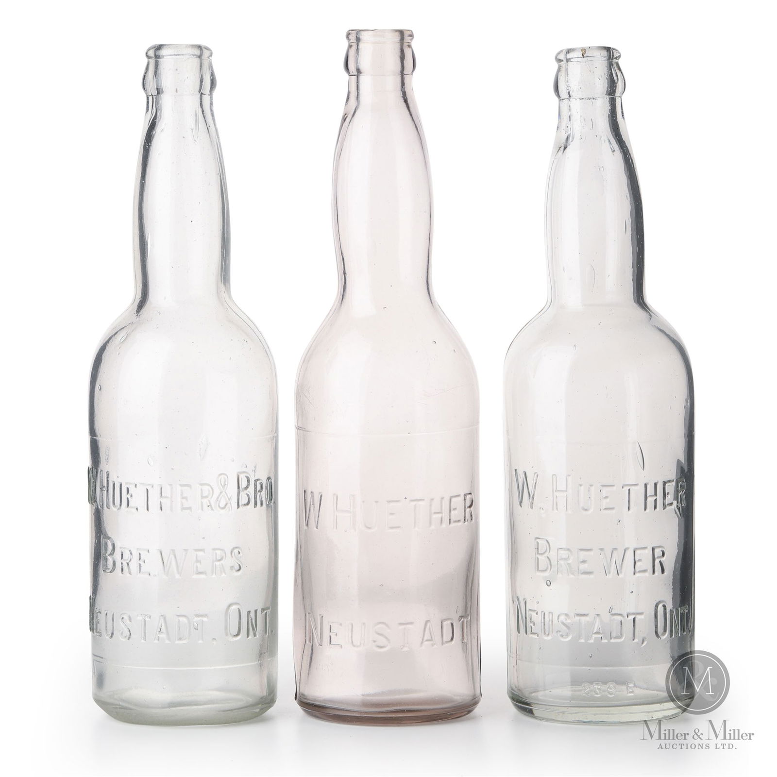 W. Huether Brewery Neustadt, Ontario Beer Bottles: Canadian. 1910s. Glass. 10.5" x 2.75" x 2.75" each. From the William Robert Wilson Collection.