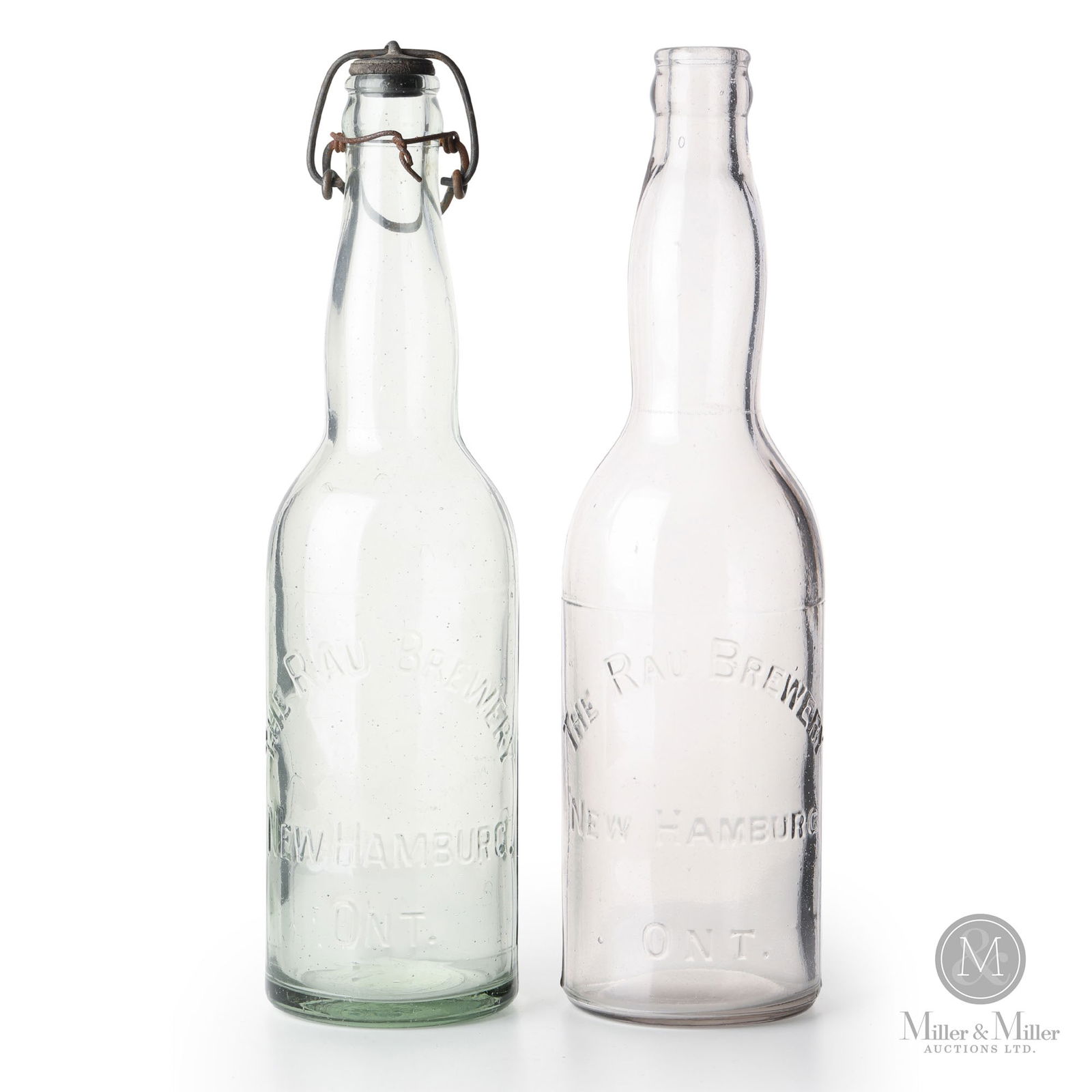 Rau Brewery New Hamburg, Ontario Beer Bottles: Canadian. 1900s. Glass. 10.25" x 2.75" x 2.75" each. From the William Robert Wilson Collection.