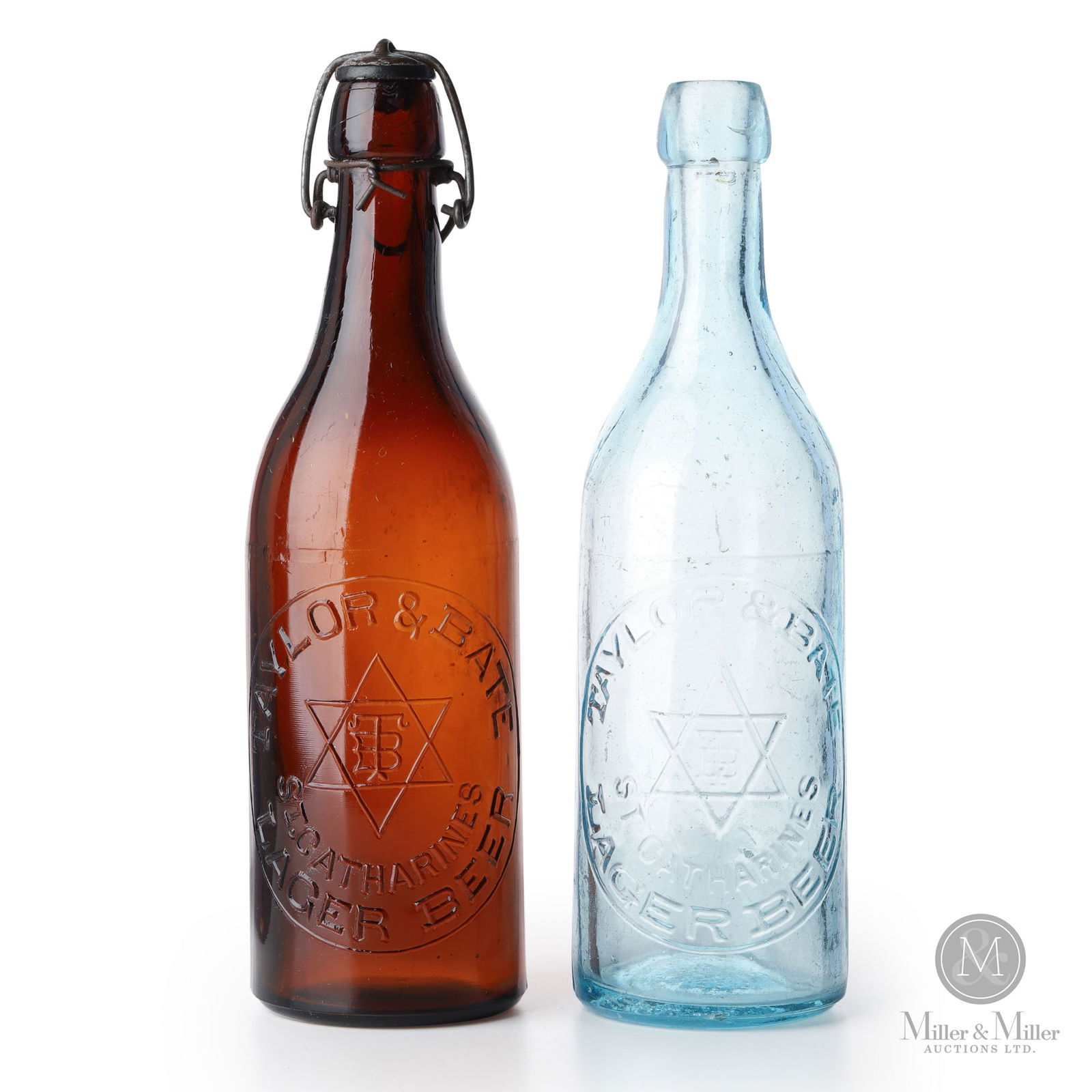 Taylor & Bate Brewery St. Catharine's, Ontario Beer Bottles: Canadian. 1890s. Glass. 9.75" x 2.75" x 2.75". From the William Robert Wilson Collection.