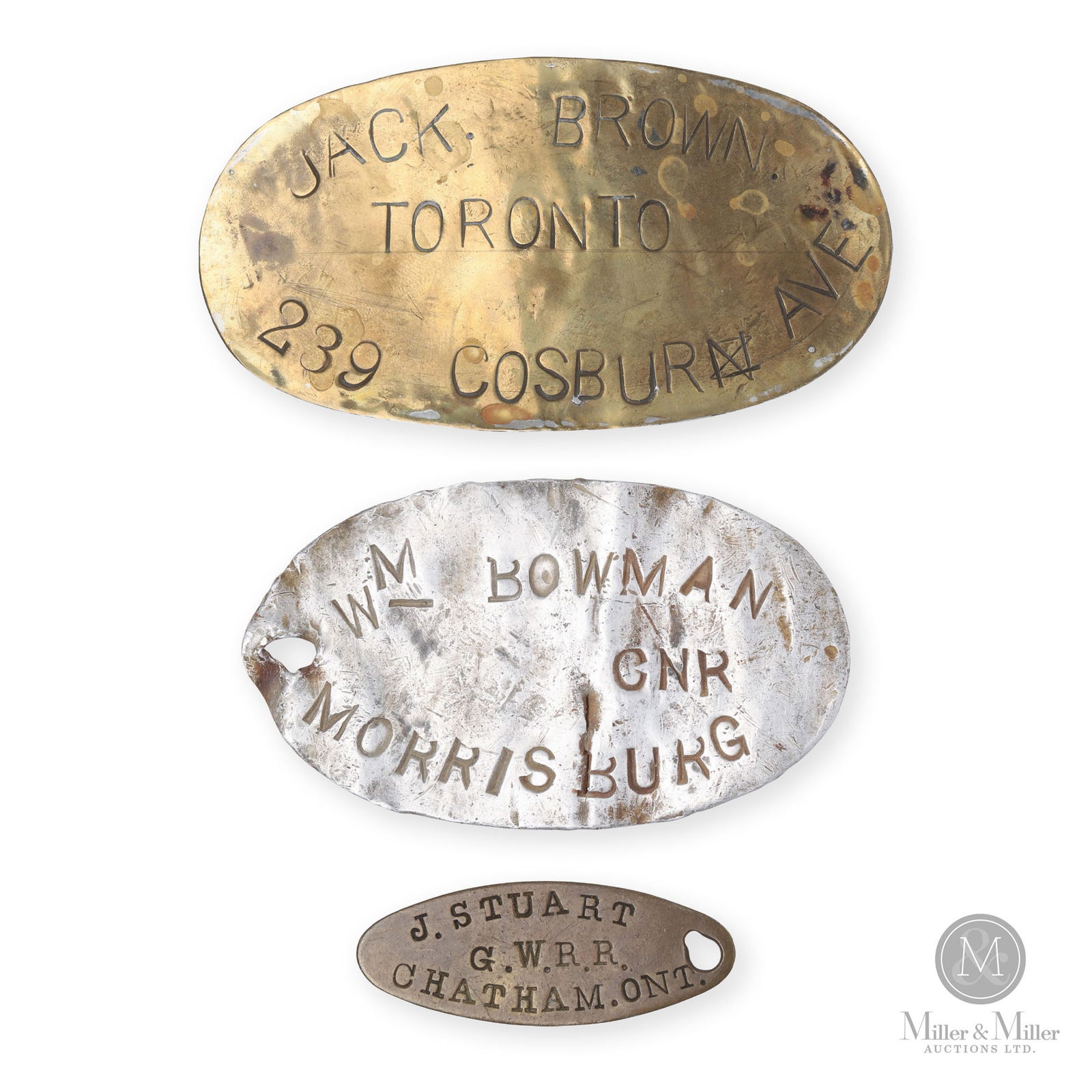 GWR & CNR Employee Tags: Canadian. 1910s. Stamped aluminum, brass. 0.75" x 2.25", 2.25" x 3.75", and 2.25" x 4.25". From the William Robert Wilson Collection.
