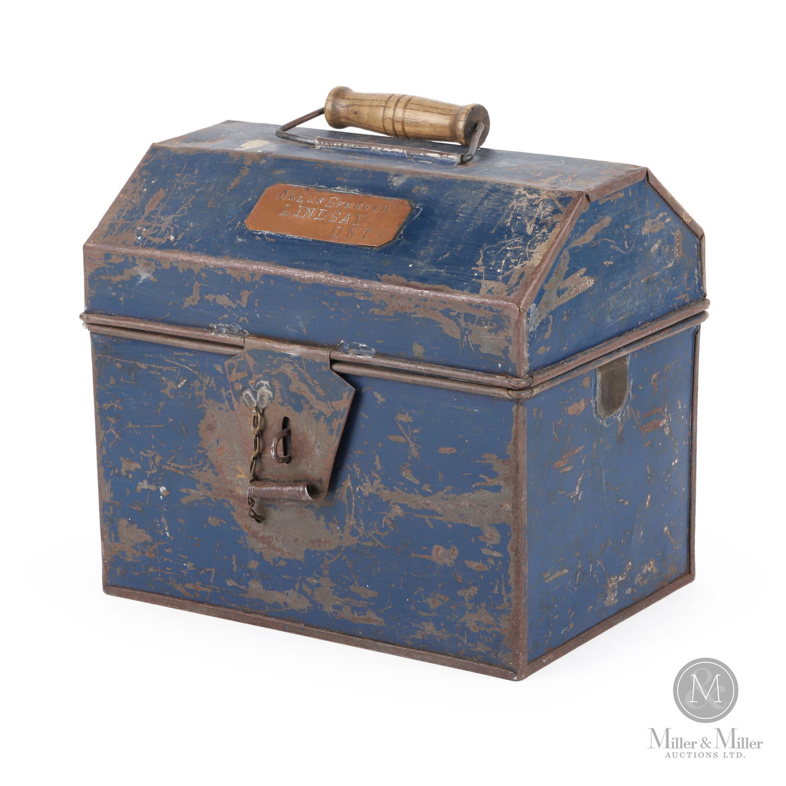 Lindsay, Ontario Trainman's Lunchbox: Canadian. 1920s. Painted steel with applied brass tag. Stamped, "Allan Spencer Lindsay Ont", on top of lid of applied brass tag. 9" x 10" x 7". From the William Robert Wilson Collection.