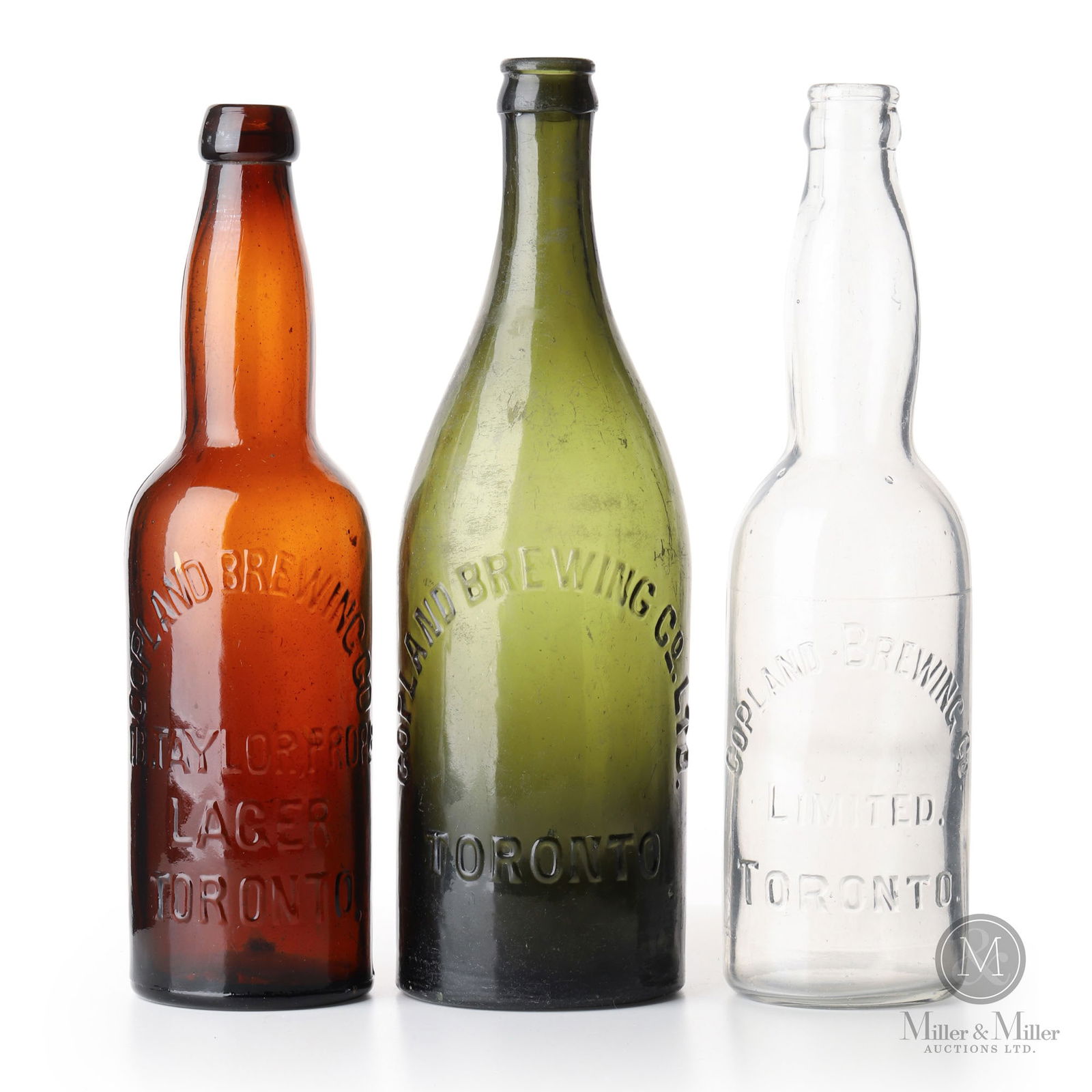 Copland Brewing Co. Toronto, Ontario Beer Bottles: Canadian. 1890s-1910s. Glass. 10" x 2.75" x 2.75", 10.25" x 2.5" x 2.5", and 10.5" x 3.25" x 3.25". From the William Robert Wilson Collection.