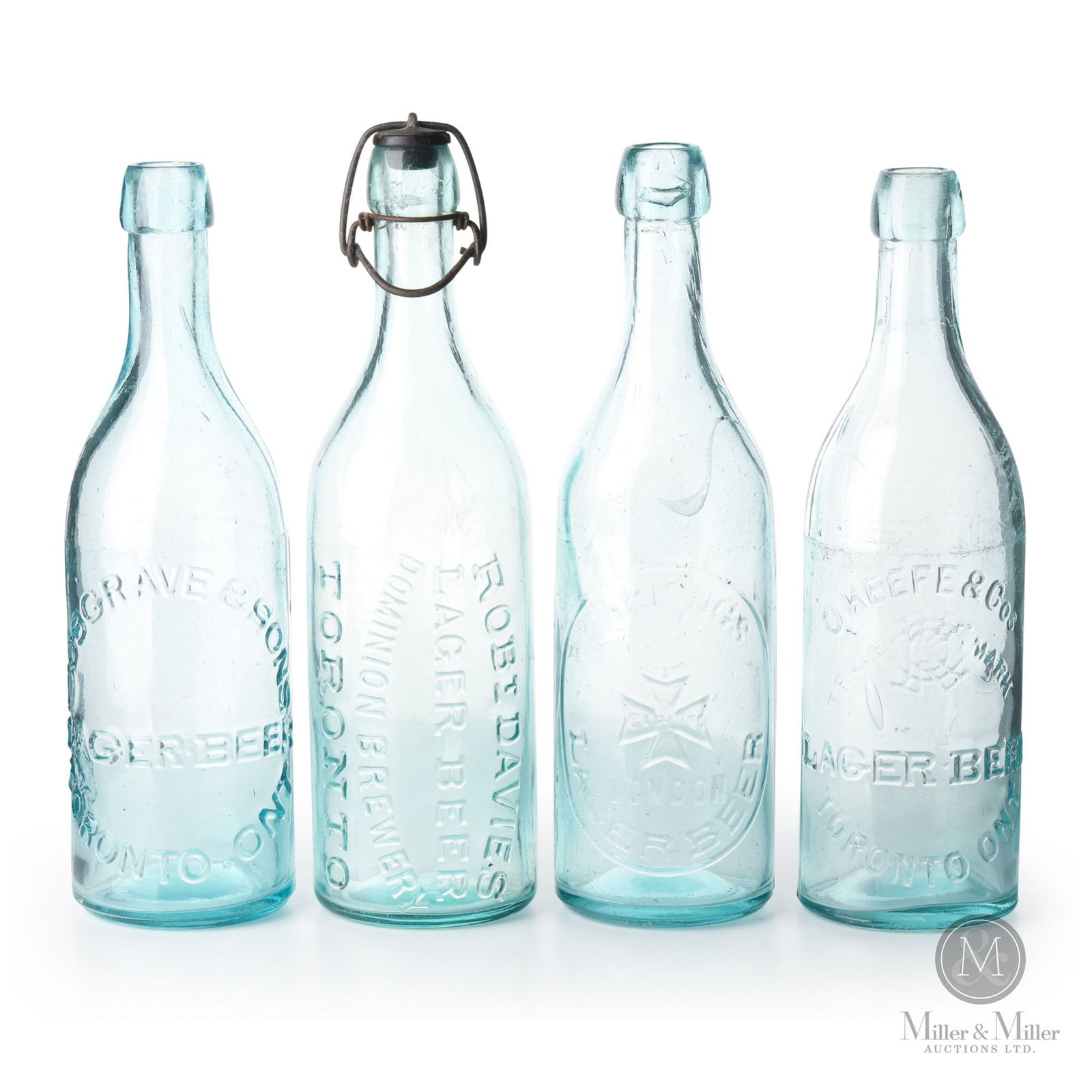 Cosgraves, Carling's, O'Keefe & Co. Breweries Toronto, Ontario Beer Bottle: Canadian. 1890s. Glass. Includes Cosgrave and Sons, O'Keefe and Cos, Robt Davies, and Carling's blob top bottles. 9.75" x 2.75" x 2.75". From the William Robert Wilson Collection.