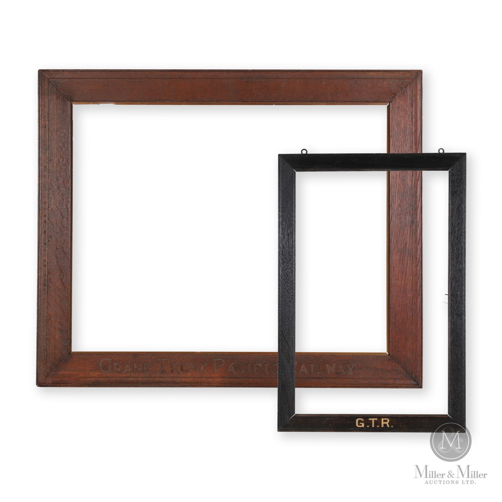 Grand Trunk Railway Marked Poster Frames: Canadian. 1890s-1910s. Stamped and painted wood. To fit artwork: 22" x 14" and 22" x 28". Overall: 24.25" x 16.5" and 28" x 34". From the William Robert Wilson Collection.