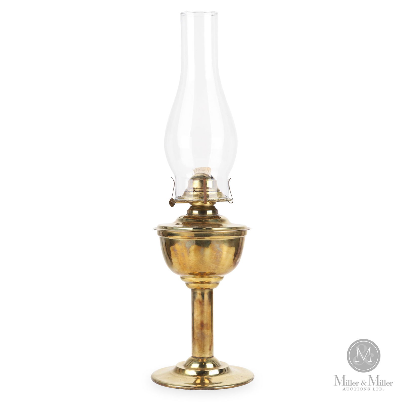 H.L. Piper Grand Trunk Railway Desk Lamp: Canadian. 1910s. Brass with glass chimney. Marked, "H.L.P Ltd. Montreal GTR", on top of fount. 11.5" x 5" x 5". From the William Robert Wilson Collection.