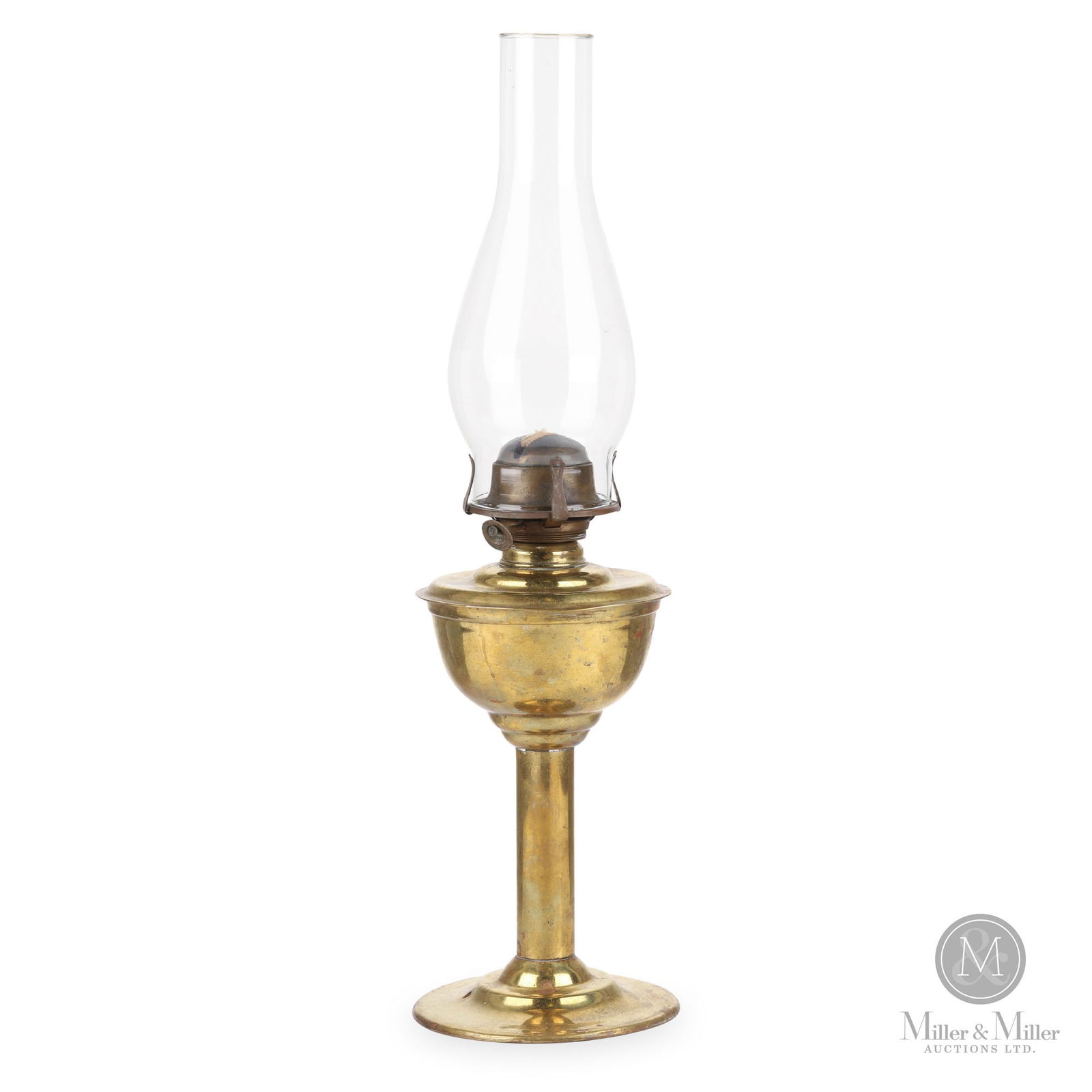 H.L. Piper Grand Trunk Railway Station Desk Lamp: Canadian. 1910s. Brass with glass chimney. Marked, "HL Piper Montreal" and "G.T.R", on top of fount. 12" x 5.5" x 5.5" (not including chimney). From the William Robert Wilson Collection.