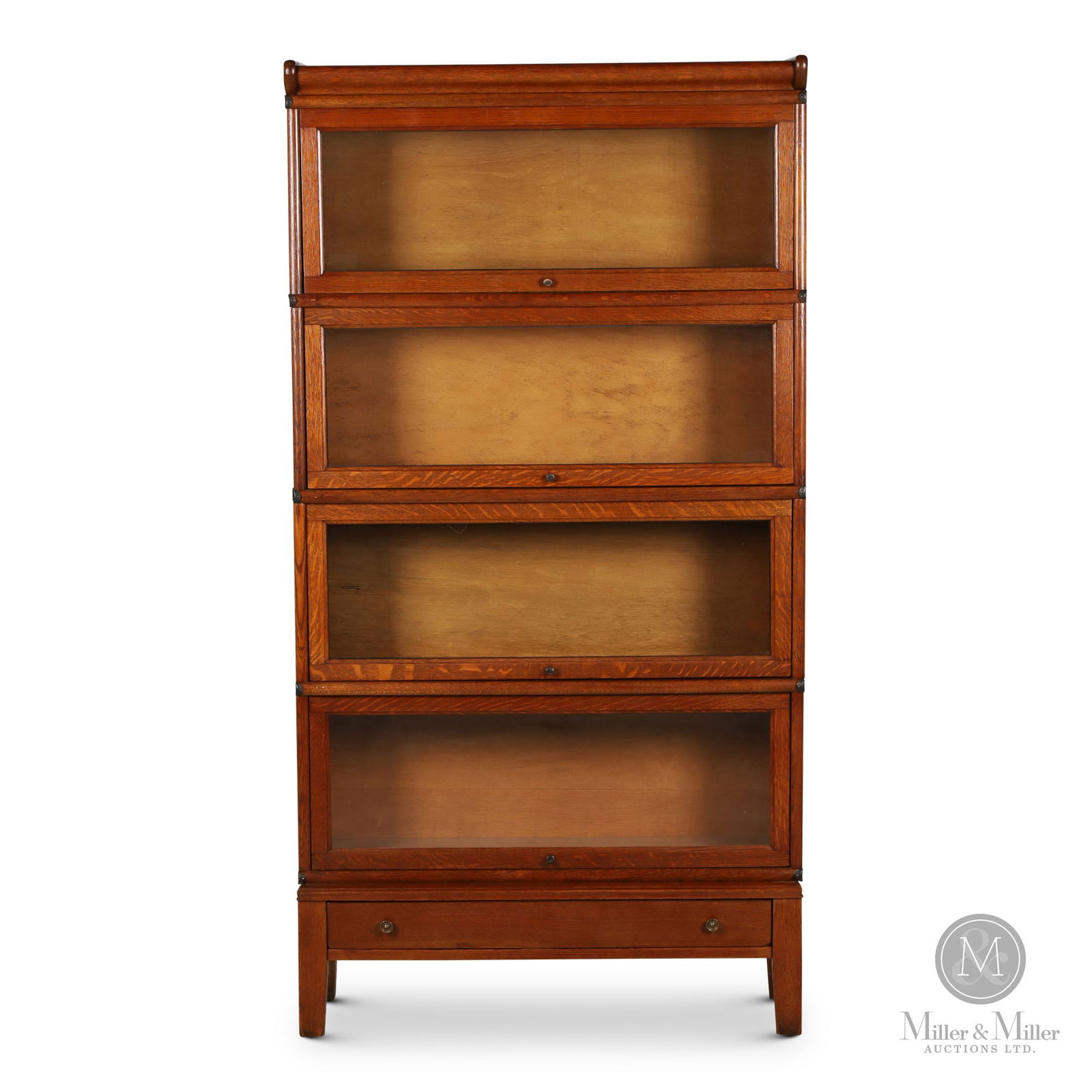 4-Section Stacking Barrister's Bookcase: Canadian. 1920s. Quarter sawn oak. Features step out base with drawer. 65" x 34" x 11". From the William Robert Wilson Collection.
