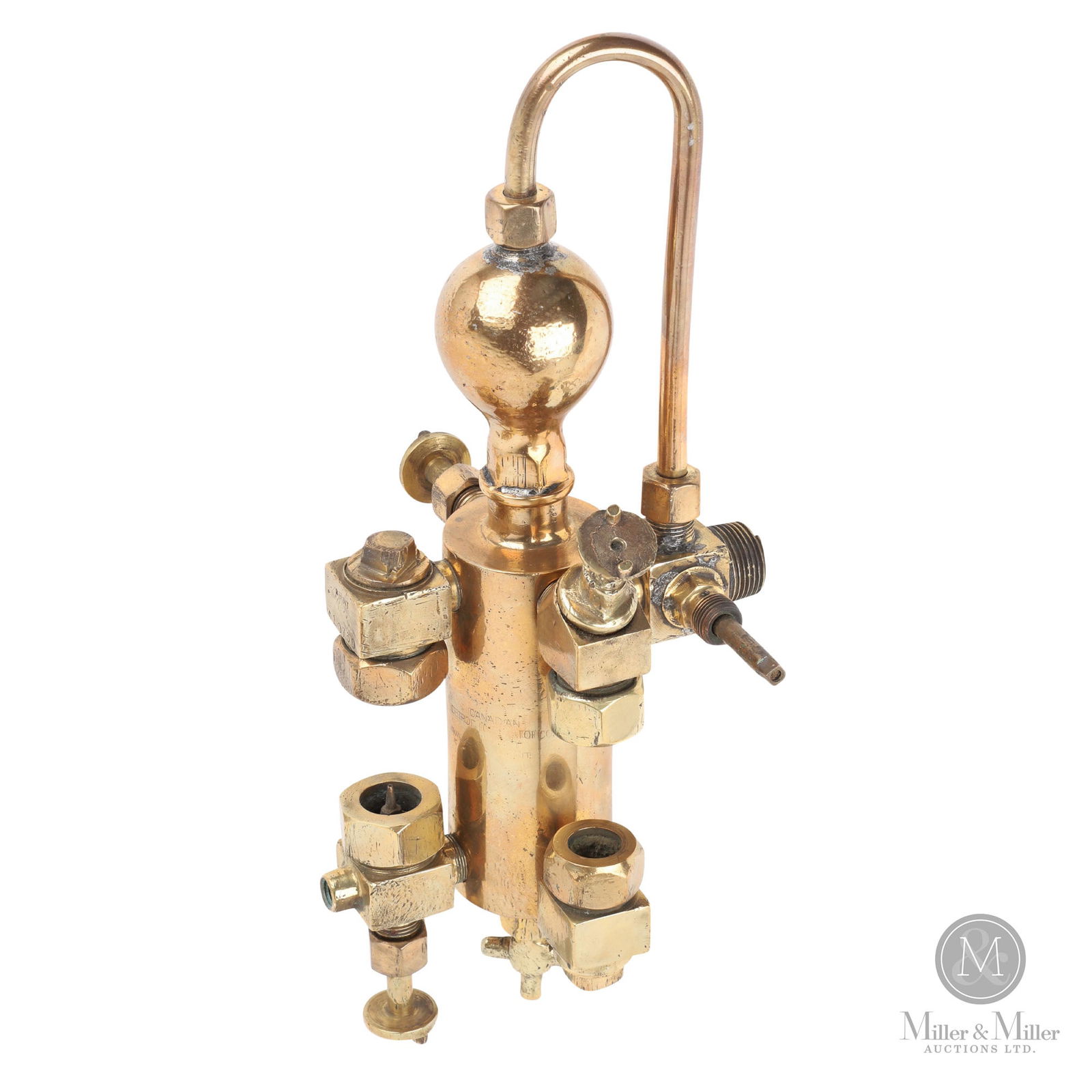 Canadian Detroit Co. Hydrostatic Lubricator: Canadian. 1920s. Brass. Marked, "Canadian Detroit Lubricator Co. Ltd.", on pressure ball. 13.5" x 6" x 6". From the William Robert Wilson Collection.