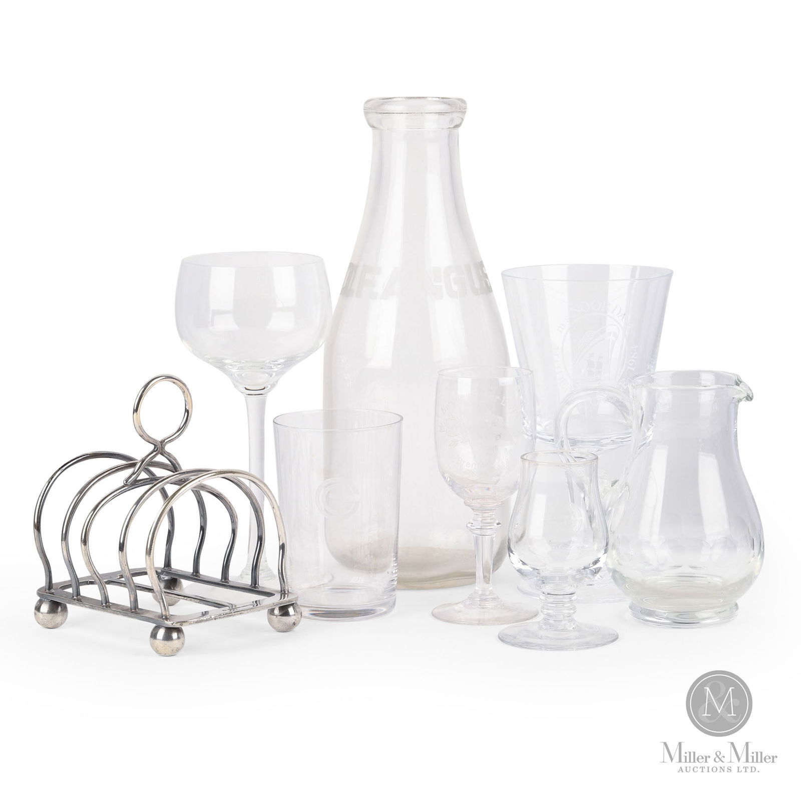 Ship's Glassware & OCR Toast Rack: Early 20th Century. Assorted materials. Incudes: milk jug, small water pitcher, small wine glass, small scotch glass, water glass, two wine glasses, and toast rack. Marked, with the logo on the top of