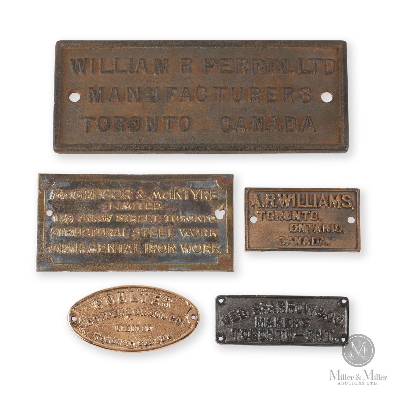 Toronto Machinery Manufacturers Plates: Canadian. 1910s-1930s. Cast iron, brass. Ranges in length from 4.5" to 10.5". From the William Robert Wilson Collection.