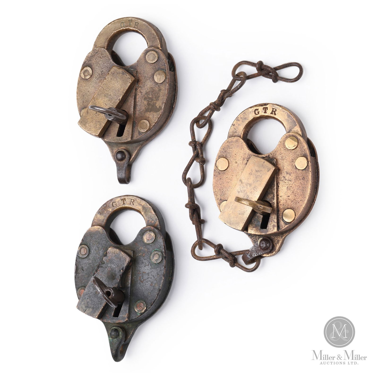 Grand Trunk Railway Switch Locks: Canadian. 1890s-1910s. Mixed metals. Stamped, "GTR", on each shackle and key. Each: 3.75" x 2.5" x 0.75". From the William Robert Wilson Collection.