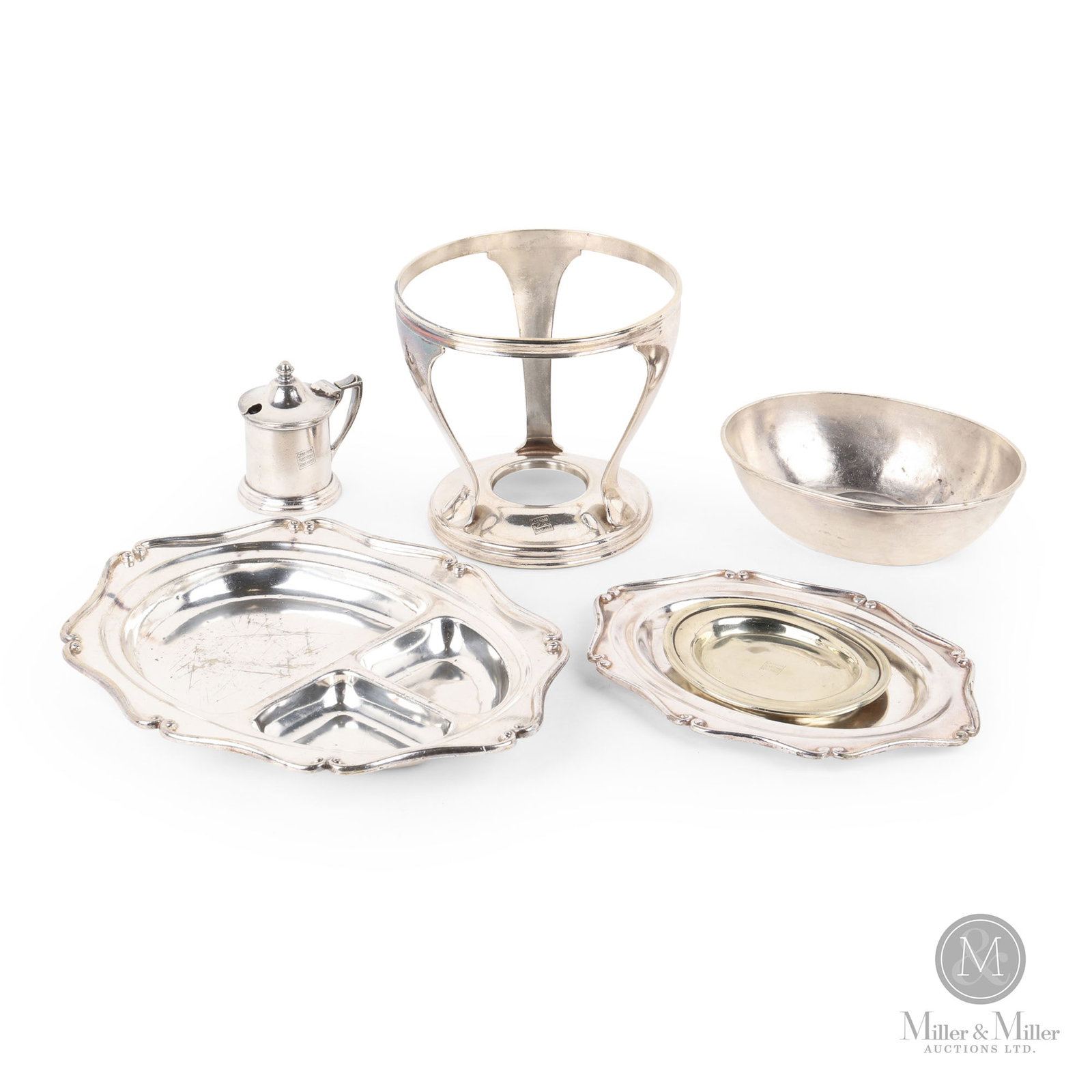 Canadian National Railway Ware: Early 20th Century. Silverware. Includes: divided tray, oval tray, cash tray, medium dome, mustard pot, and stand. Marked, with the logo on the top of rim or center front of most pieces. Marked, on un