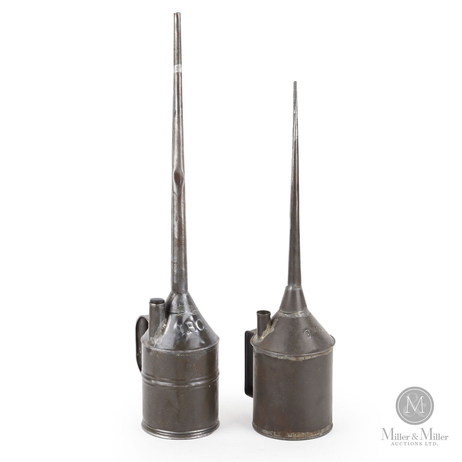 Intercolonial Railway & CNR Long Spout Oilers: Canadian. 1900s. Painted tin. Rare. Stamped and embossed, "I.R.C" and "CNR", on the center front of each top. 19" x 4.25" x 5.25" and 22.25" x 4.25" x 5.5". From the William Robert Wilson Collection.