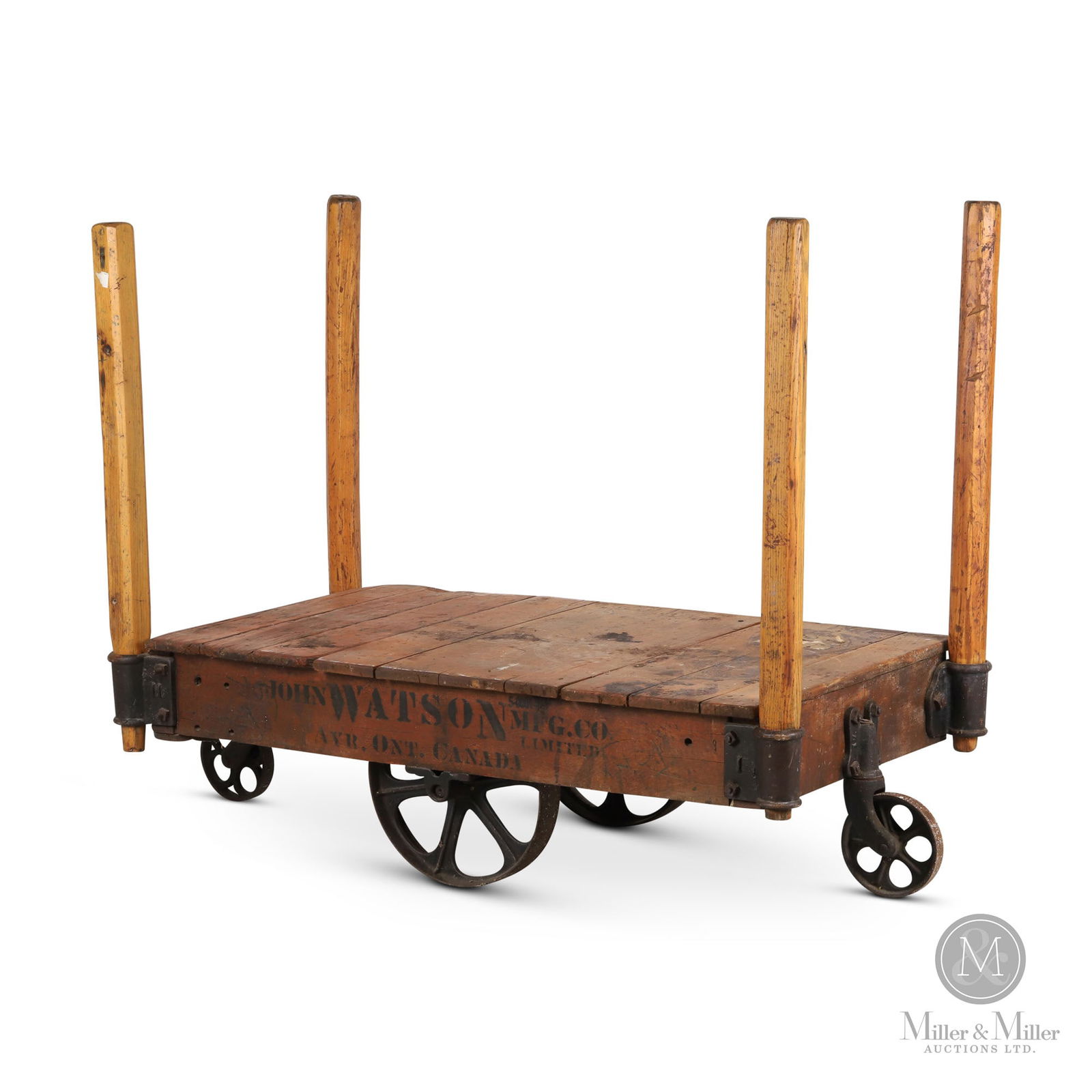 John Watson Mfg Co., Ayr Foundry Cart: Canadian. 1920s. Finished wood with cast components. Retains four wooden posts Marked, on side panels. Cart: 14.75" x 48.25" x 27.25". Handles: 36" x 2.5". From the William Robert Wilson Collection.