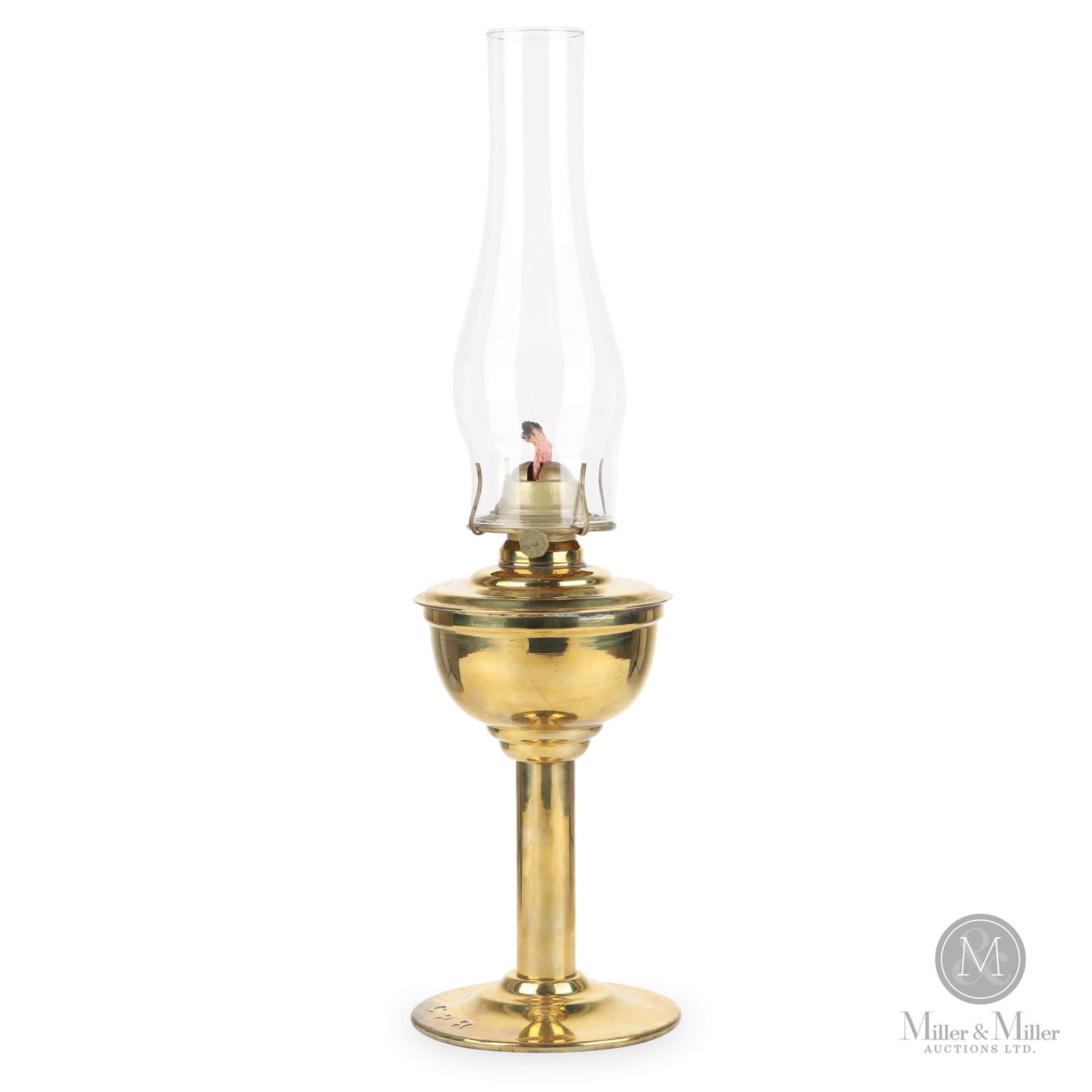 H.L. Piper CPR Station Desk Lamp: Canadian. 1910s. Brass with glass chimney. Marked, "Piper", on top of fount. Marked, "CPR", on top of base. 12" x 5.5" x 5.5" (not including chimney). From the William Robert Wilson Collection.