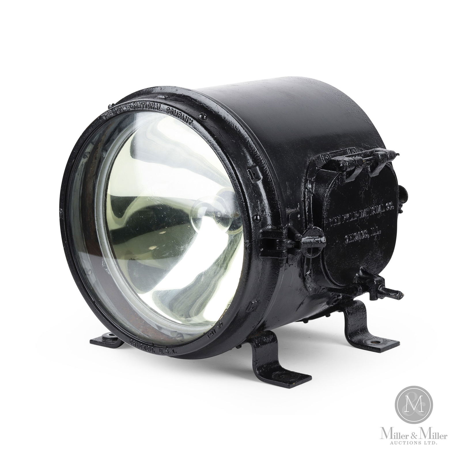 Pyle National 12" Locomotive Headlight: American. 1930s. Painted steel with cast and glass components. Marked, "The Pyle/ National Company Chicago USA 217MO", on bezel. Marked, "12012-G 10 PN52 Made in USA", on reflector dome. 12" Dia. From