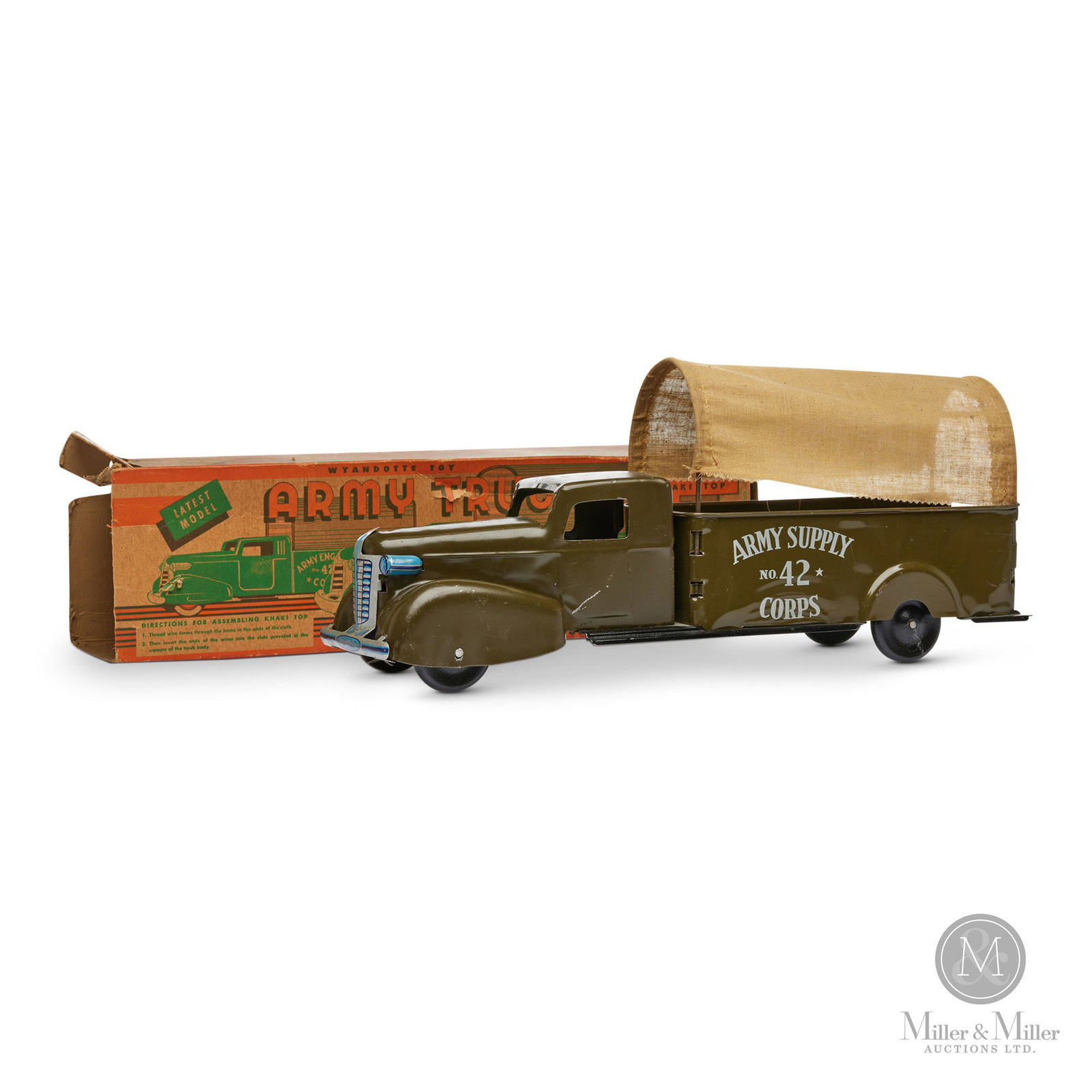Wyandotte No. 42 Army Supply Corps. Truck: American. 1940s. Marked, on front bumper, box, and rear quarter panel. Size 7.5" x 17.5" x 5". Condition Some scratches on cab door and roof. Nicks on hood. All original. Original removable canvas can