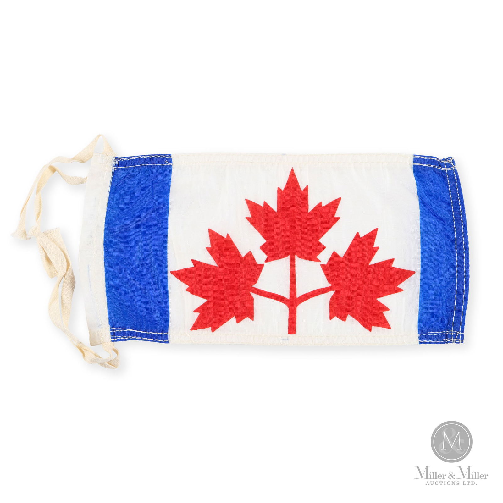 1964 Proposed Design Canada Sample Flag: Canadian. 1964. Nylon. A miniature/prototype of the proposed Canada flag, featuring three red maple leaves with blue borders. Stamped, on border. 5" x 10".