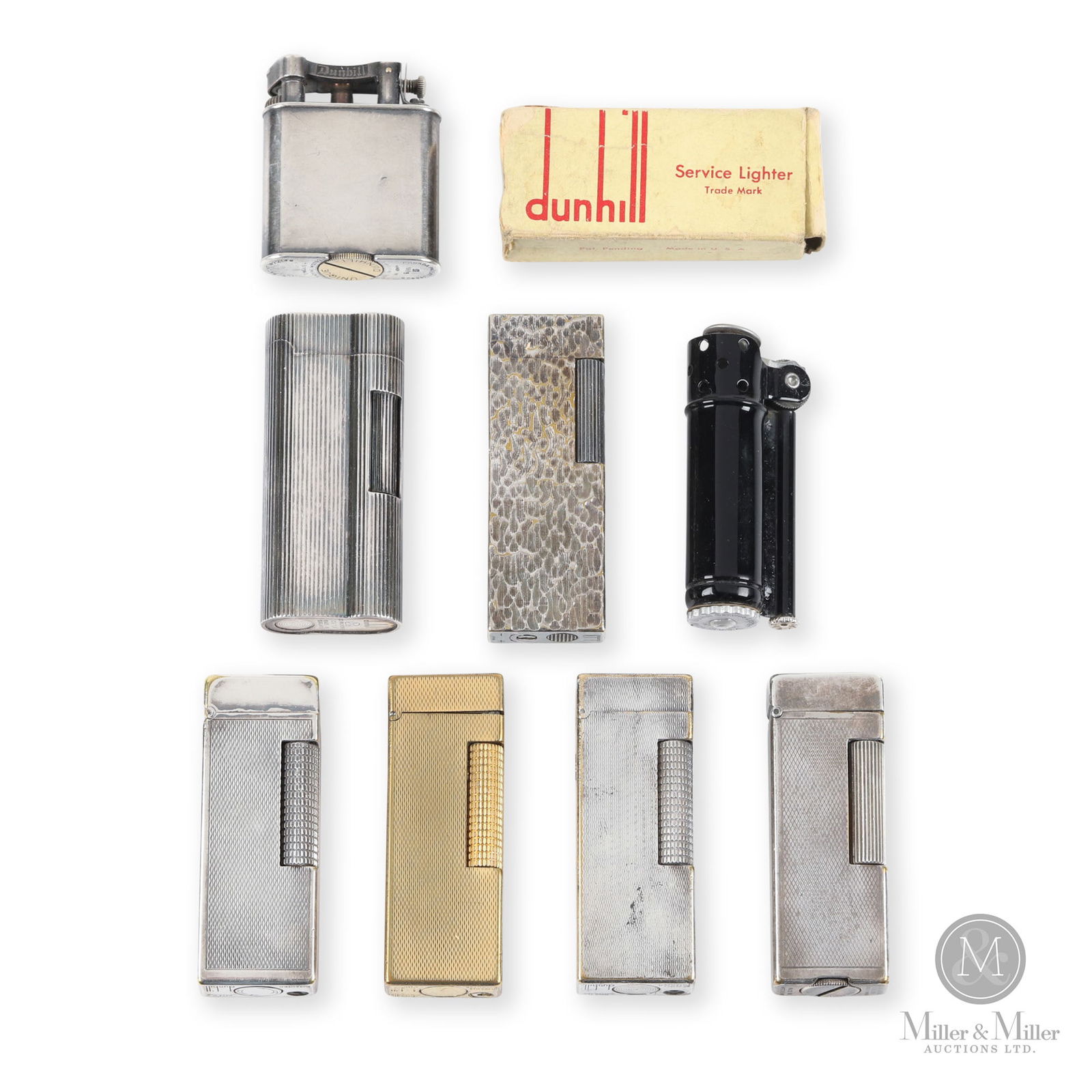 Dunhill Rollagas & Bar Lighters: English. 1940s-70s. Silver and gold plated. Includes six Rollagas, 1 Bar lighter and 1 boxed service lighter. Each stamped underneath. highest 2.75" na
