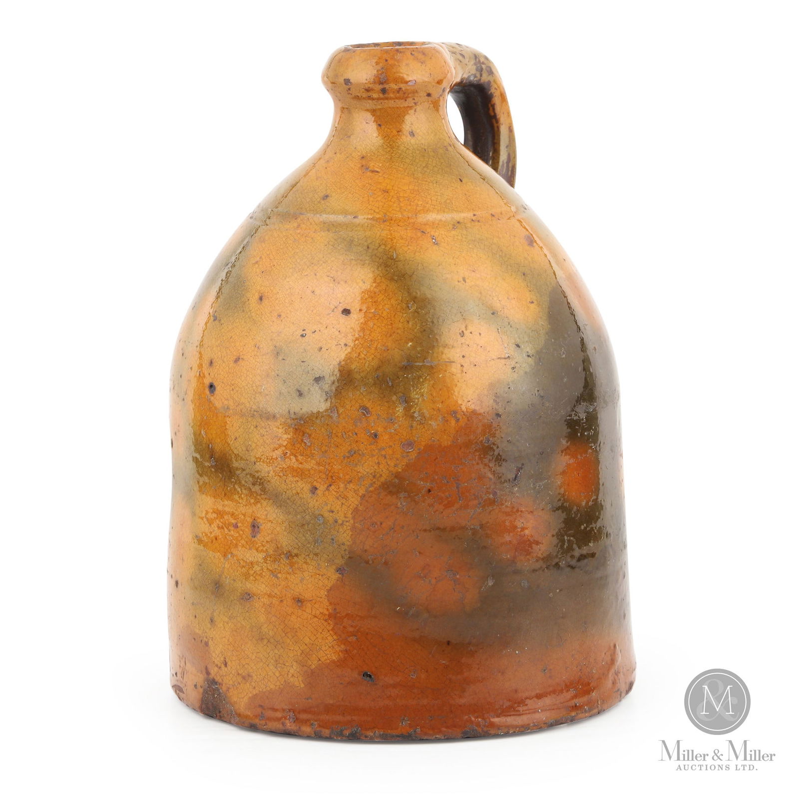 Ontario 1-Gallon Redware Jug With Mottled Green/Orange Glaze: Ontario. 1850s. Earthenware. This jug has a very distinct and appealing form. It's very heavy for its size and a faint internal odour would suggest dried contents from past use, but none could be seen