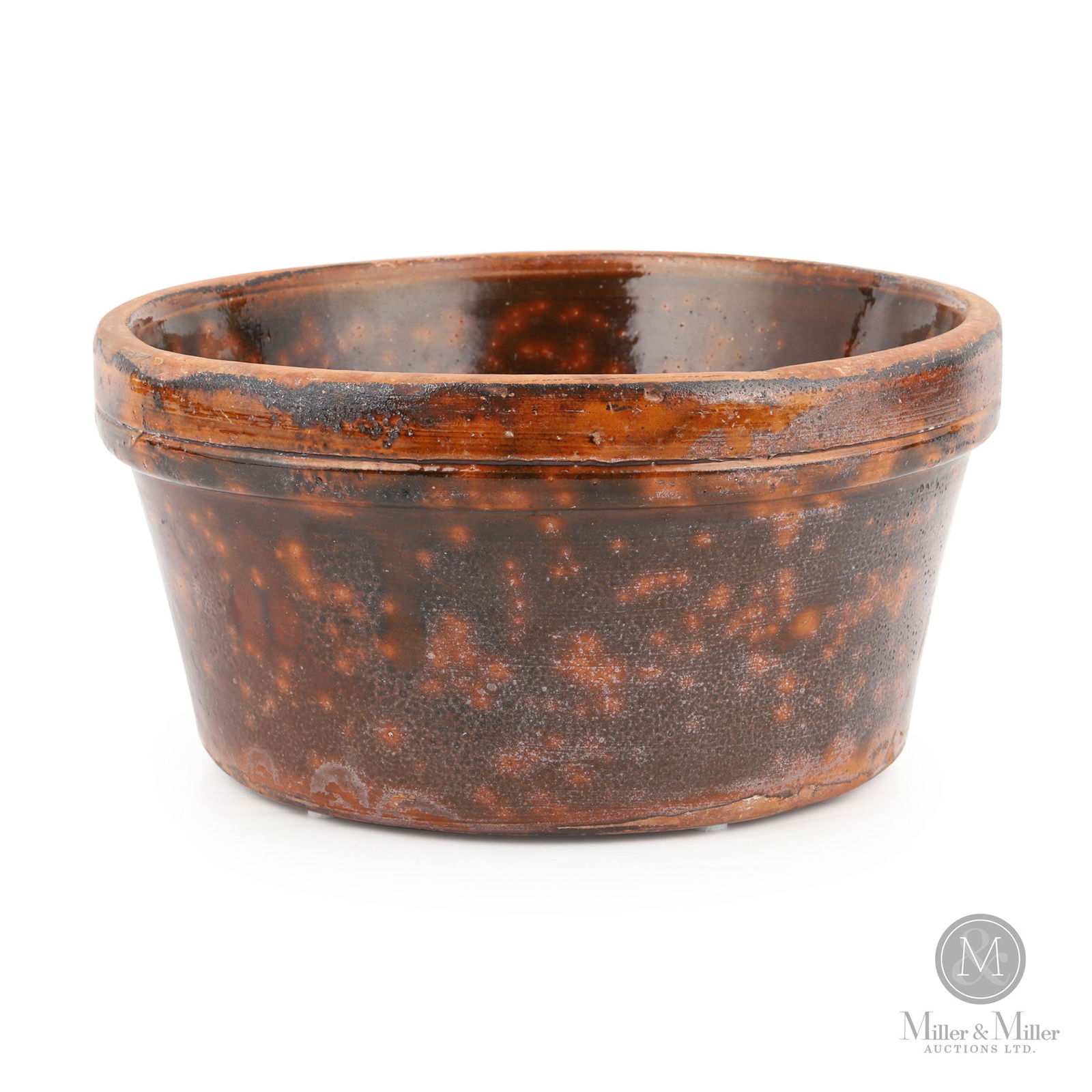 Ontario Redware Bowl With Mottled Green/Orange Glaze: Ontario. 1850s-1870s. Earthenware. The strong form of this bowl and its deep green and orange glaze provide tremendous visual appeal. Attributed to the Niagara Region, leaning towards Daniel Orth of C