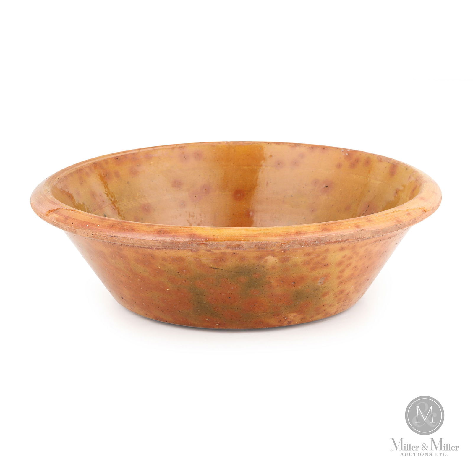 Large Ontario Redware Milk Pan: Ontario. 1860s-1880s. Earthenware. A fabulous mottled orange glaze with splashes of light green. Opinions vary on attribution but lean towards the Eby/Markham Pottery. An uncommon survivor considering